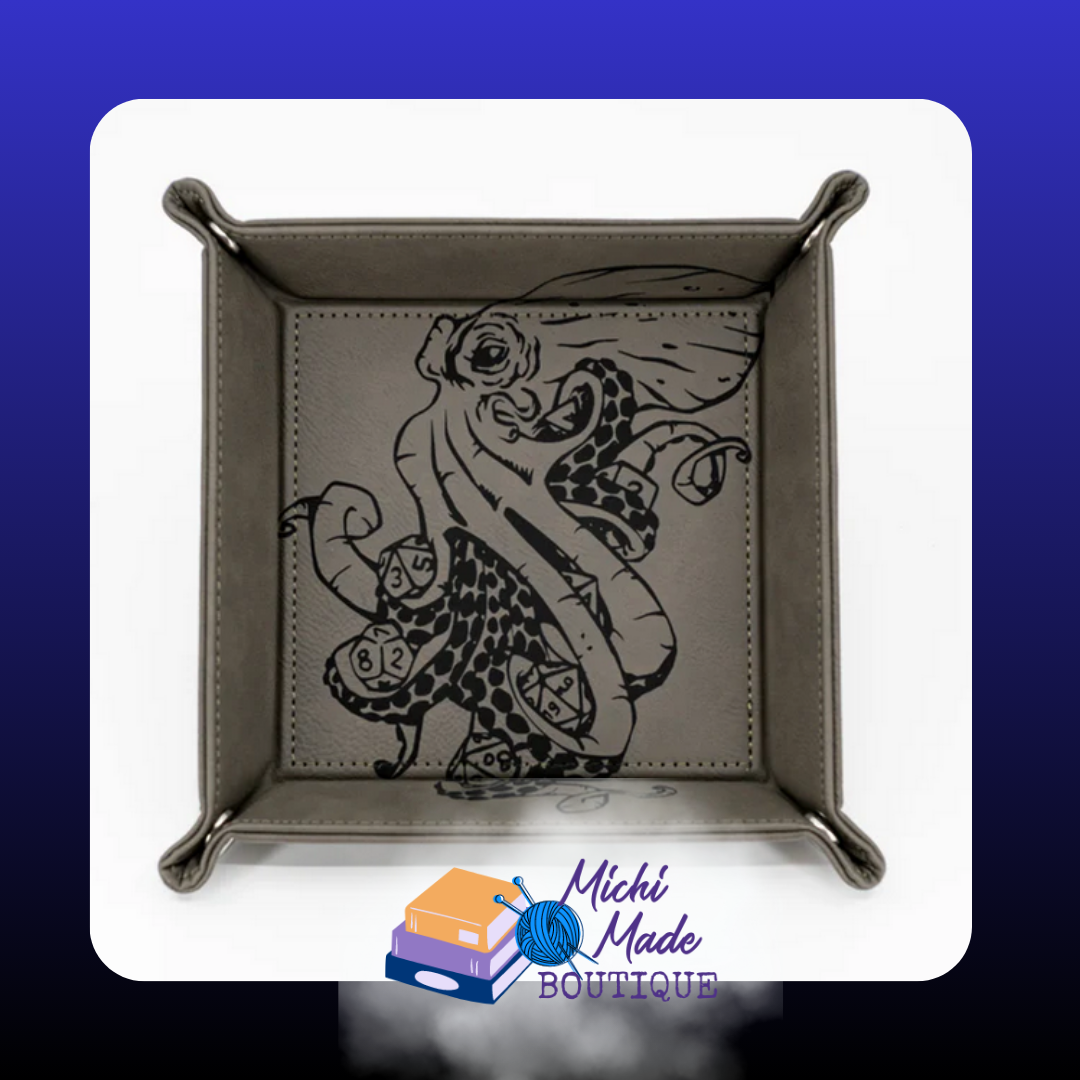 Grey tray engraved with kraken holding dice in its tentacles.