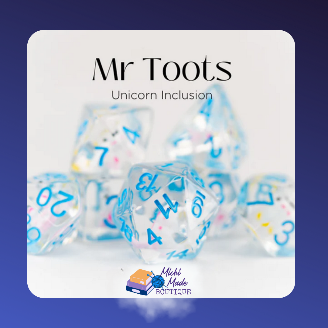 Clear dice with pastel unicorn inclusions, blue numbers – Mr. Toots set.