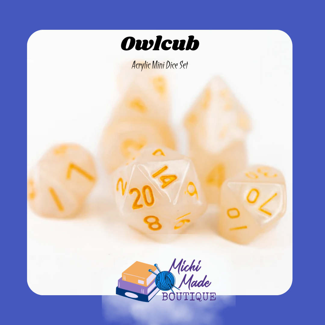 Owlcub — Creamy ivory mini dice with gold numbers, soft glow.