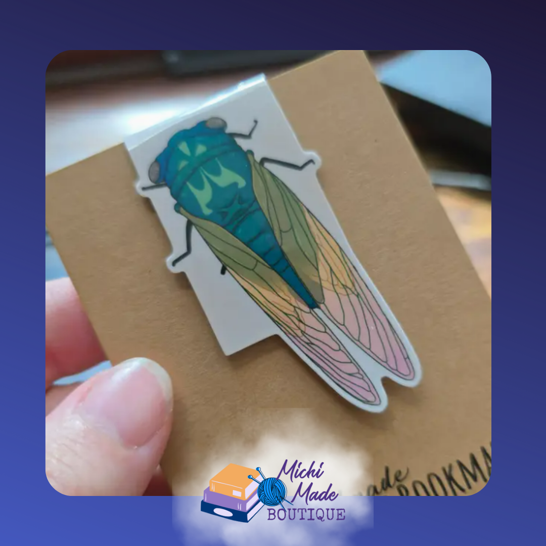 Green cicada with delicate colorful wings.