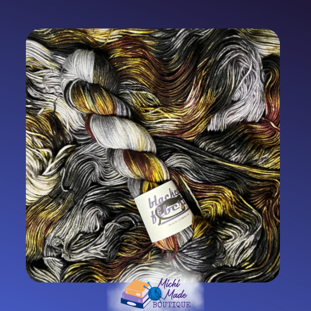 Void 1.png — Dark yarn skein in black and gray with golden highlights.
