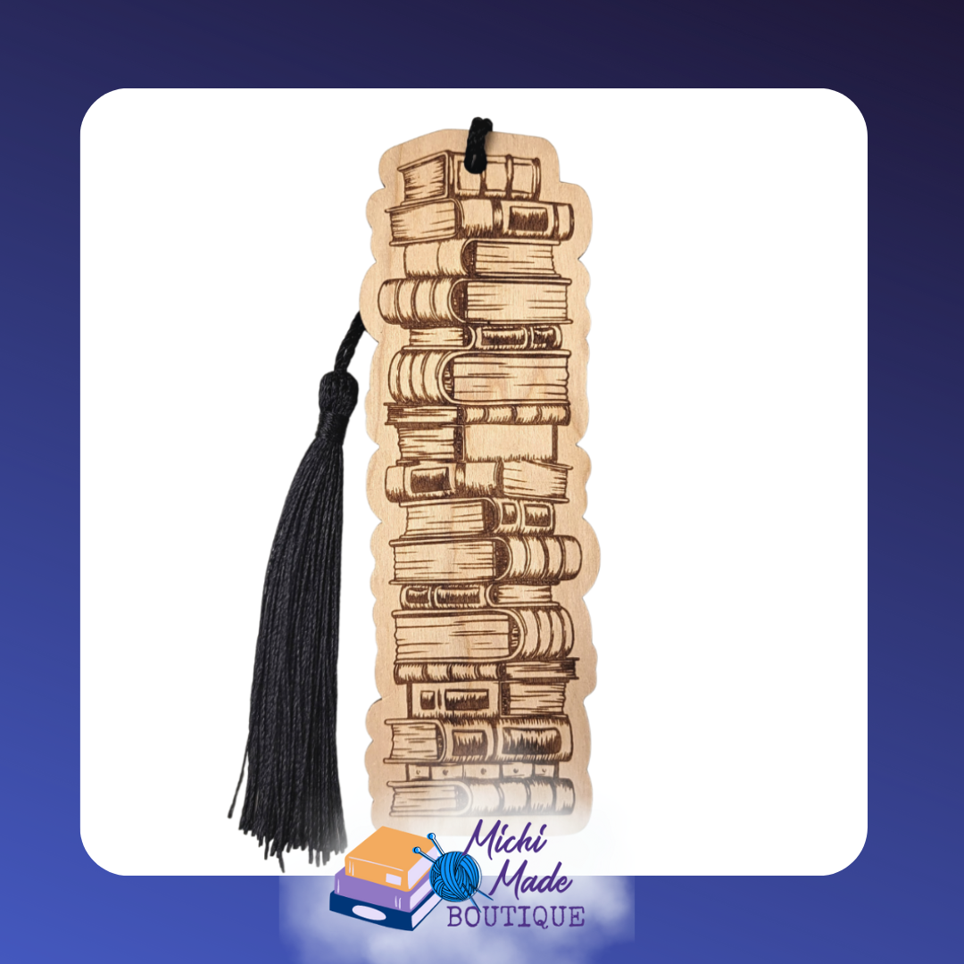 Tall wooden bookmark engraved with a stack of vintage books, with black tassel.