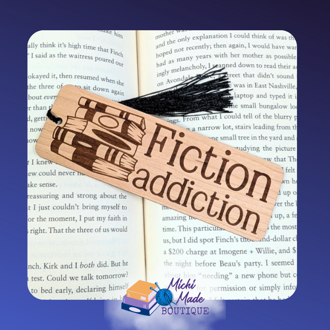 Fiction Addiction – Rectangular wood bookmark engraved with “Fiction Addiction”, a stack of books, and a black tassel.