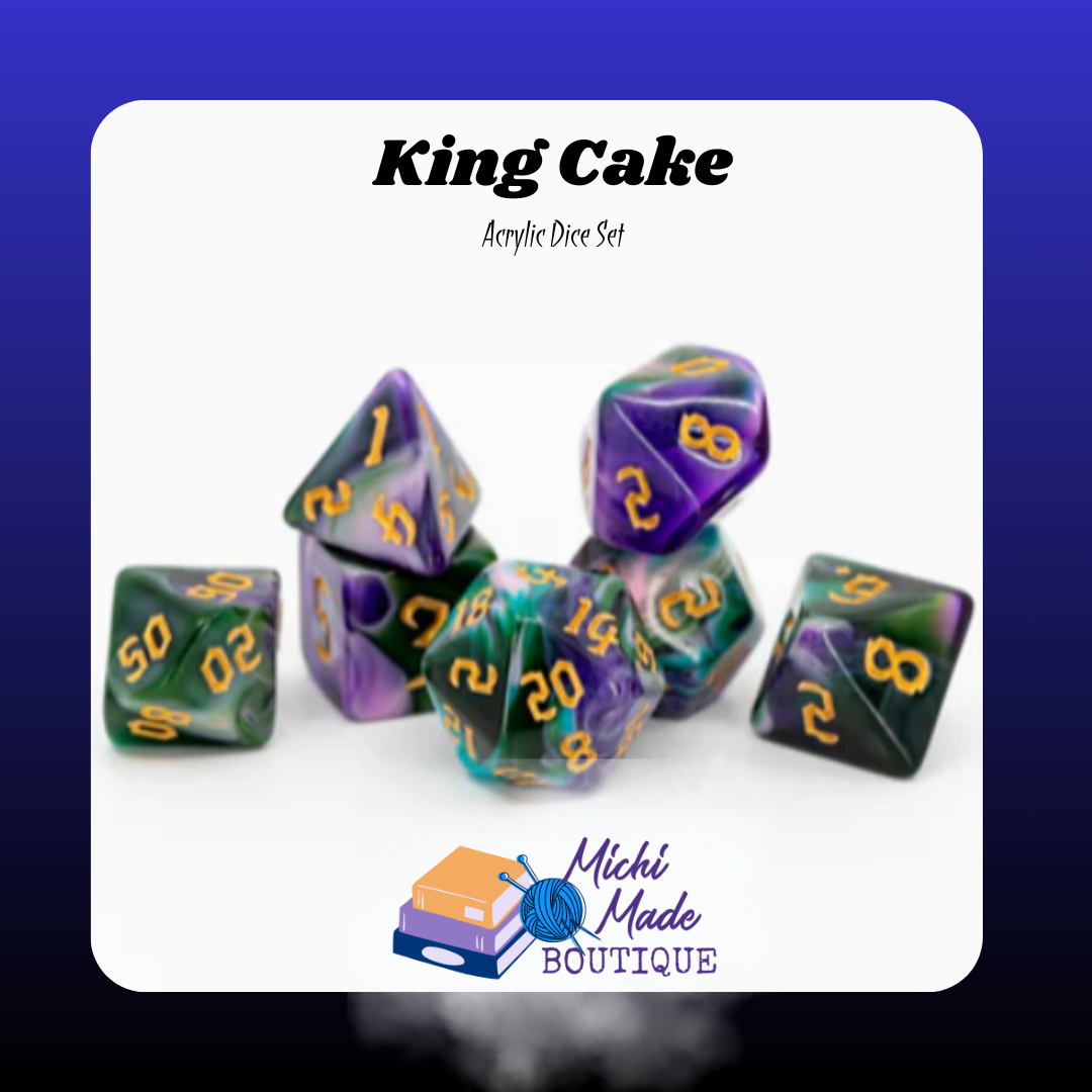 King Cake: “Purple, green, and gold-swirled acrylic dice with gold numerals.”
