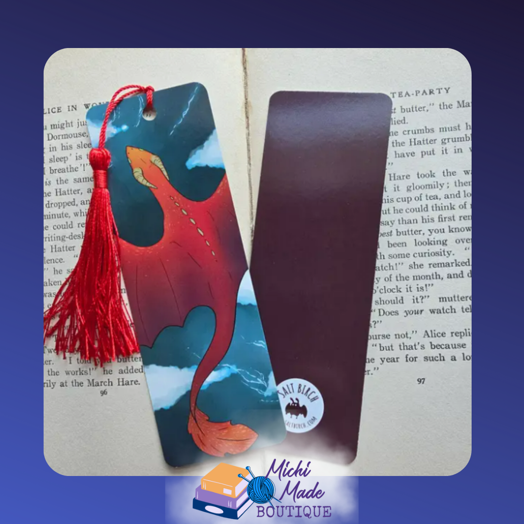 2"x6" bookmark with red dragon flying over stormy ocean, red tassel attached.