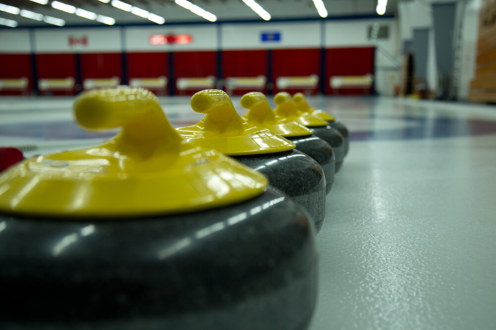 1. close up curling rocks on ice.jpg