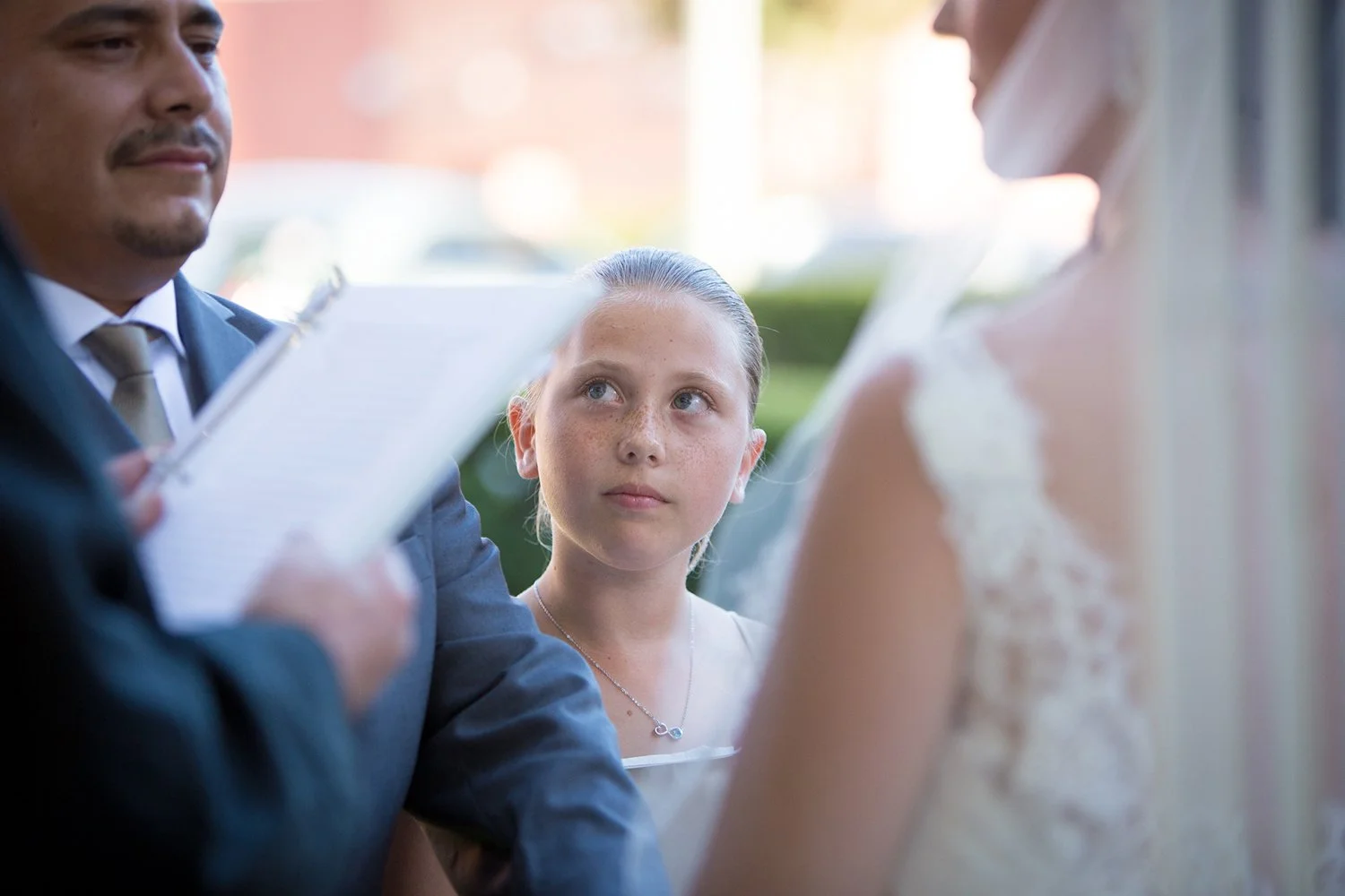 daughter-watching-mother-vows-blended-family-wedding-Santa-Barbara.jpg