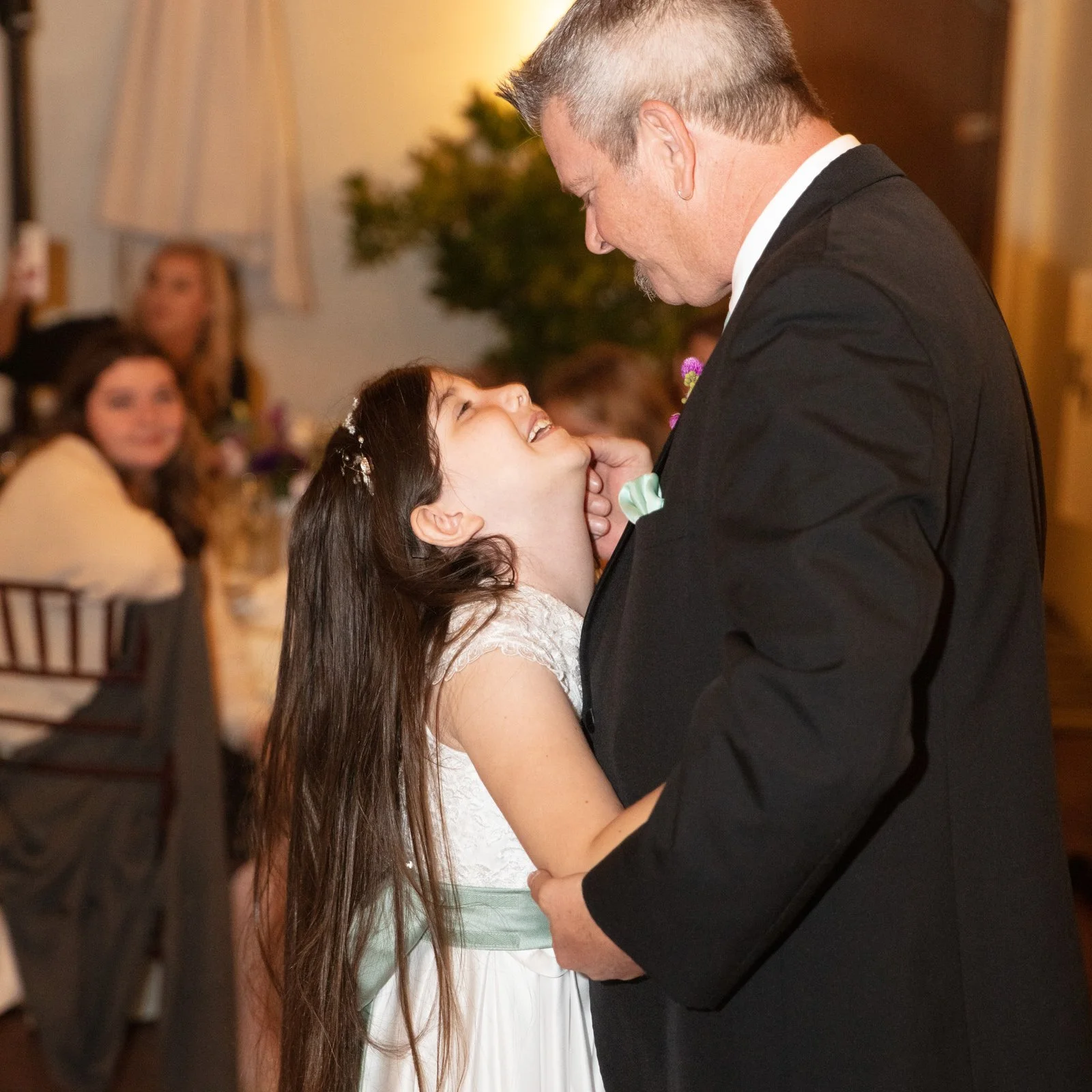 older-groom-dancing-with-flower-girl-daughter-Santa-Barbara.jpg