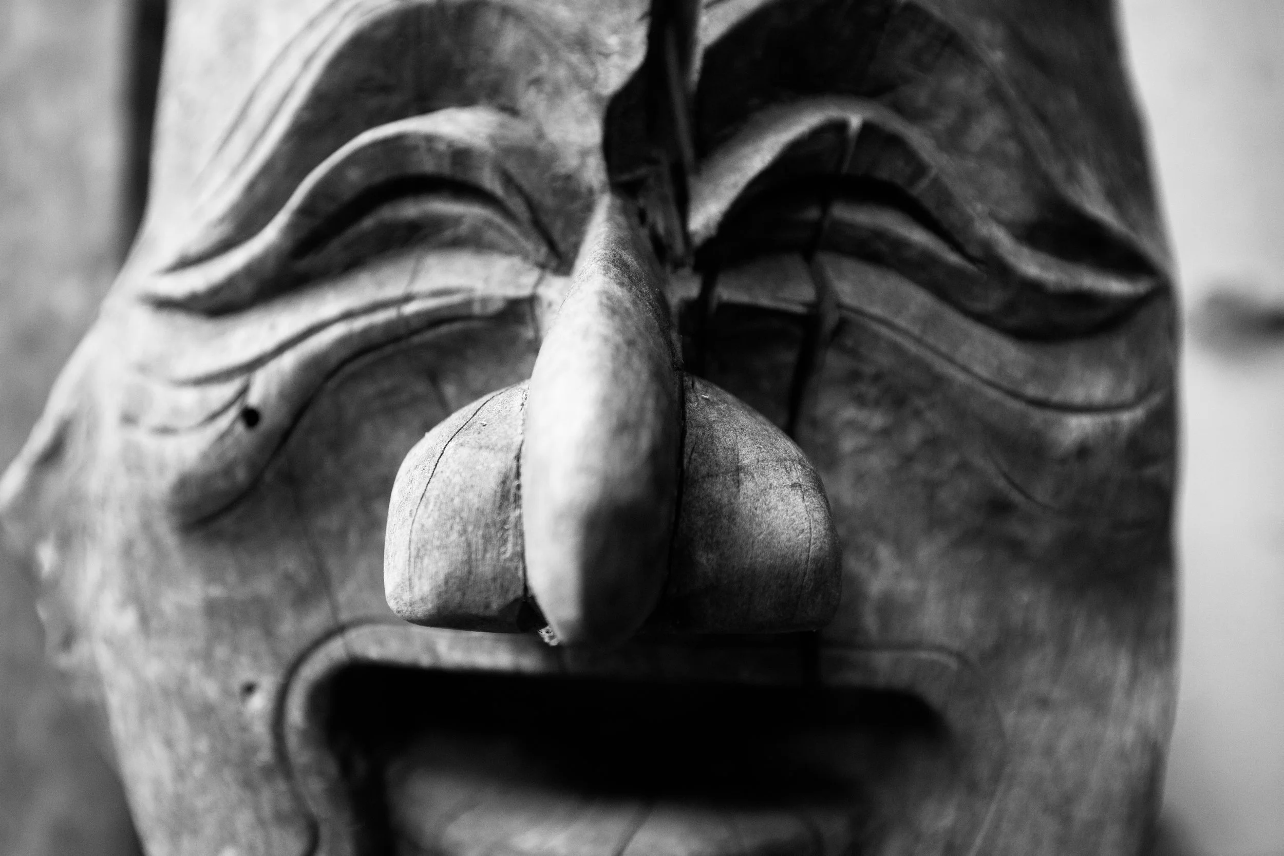 A closeup of an historic Korean wooden mask used in folk rituals and performances from Andong Hahoe folk village in South Korea.