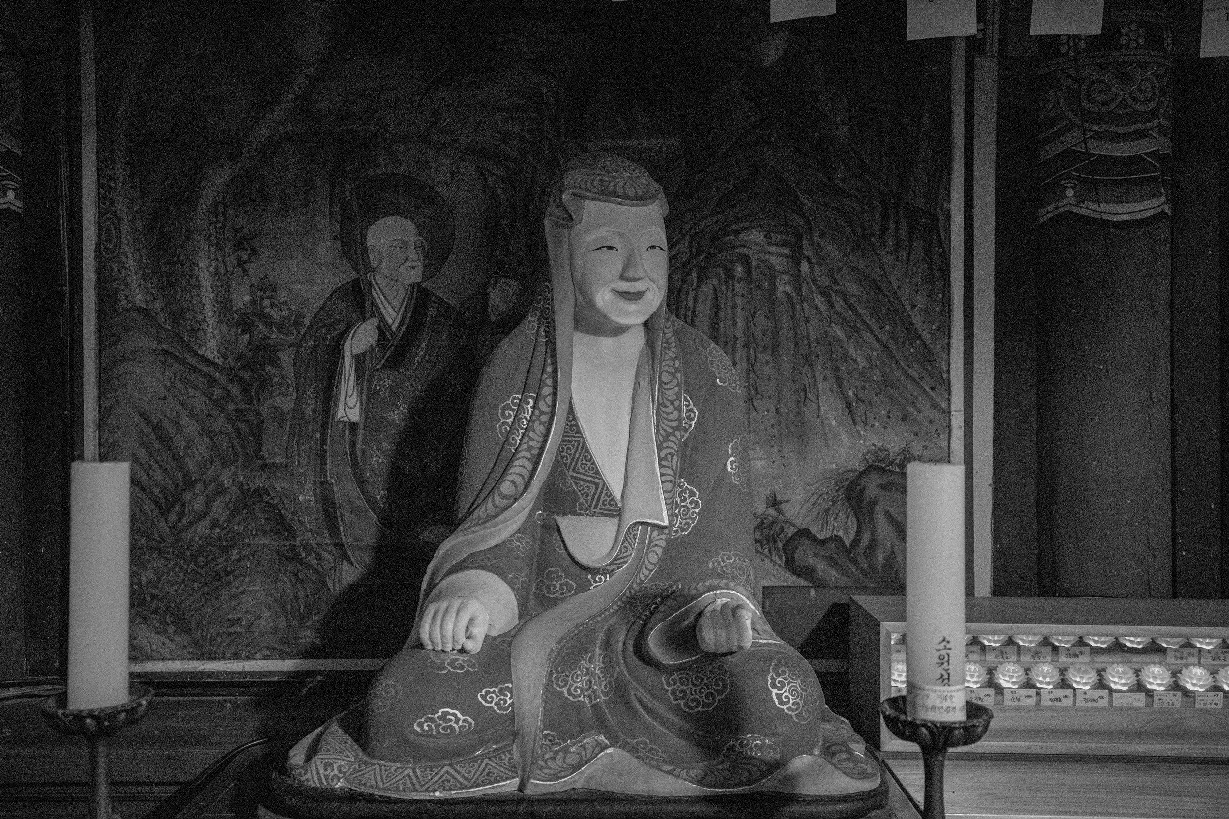 A statue of a seated Sanshin (mountain god) inside a Buddhist temple shrine in Jeonju, South Korea.