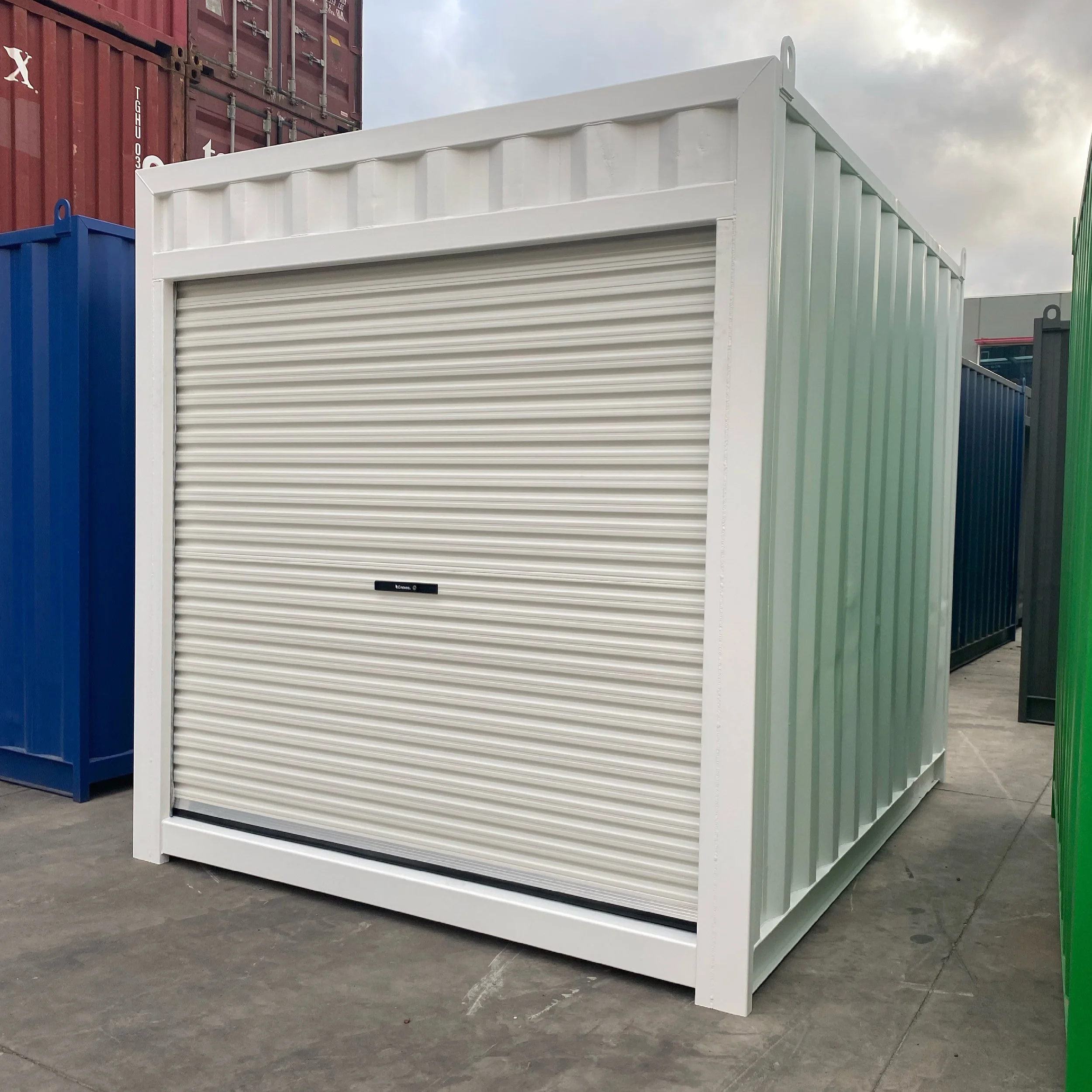 White 10ft shipping container with white rollour door at Melbourne Shipping Containers yard.