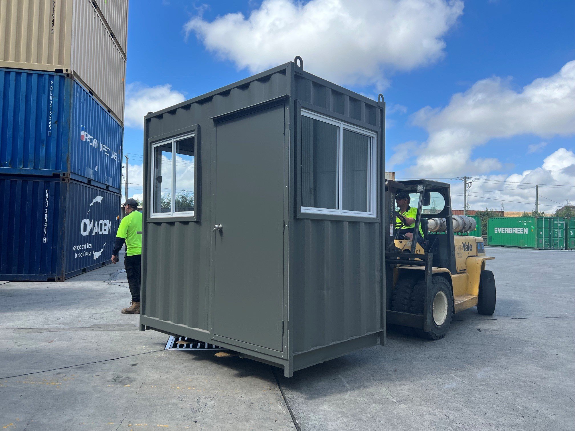 Modified shipping container with personal access door and windows, custom made at our Melbourne yard