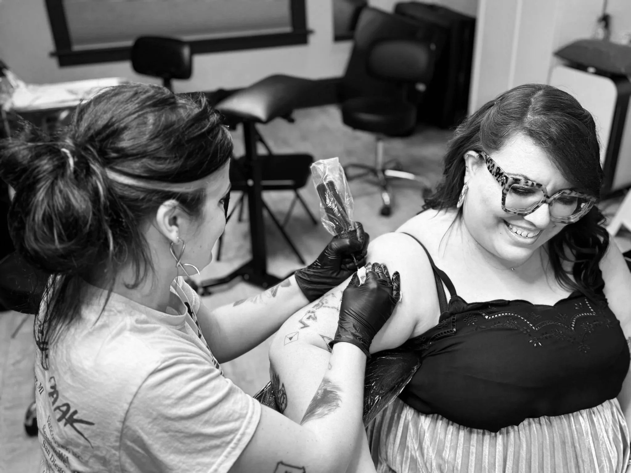 Women tattooer in SE Portland. Talented tattoo artist. Tattoo artist tattooing their happy client. 