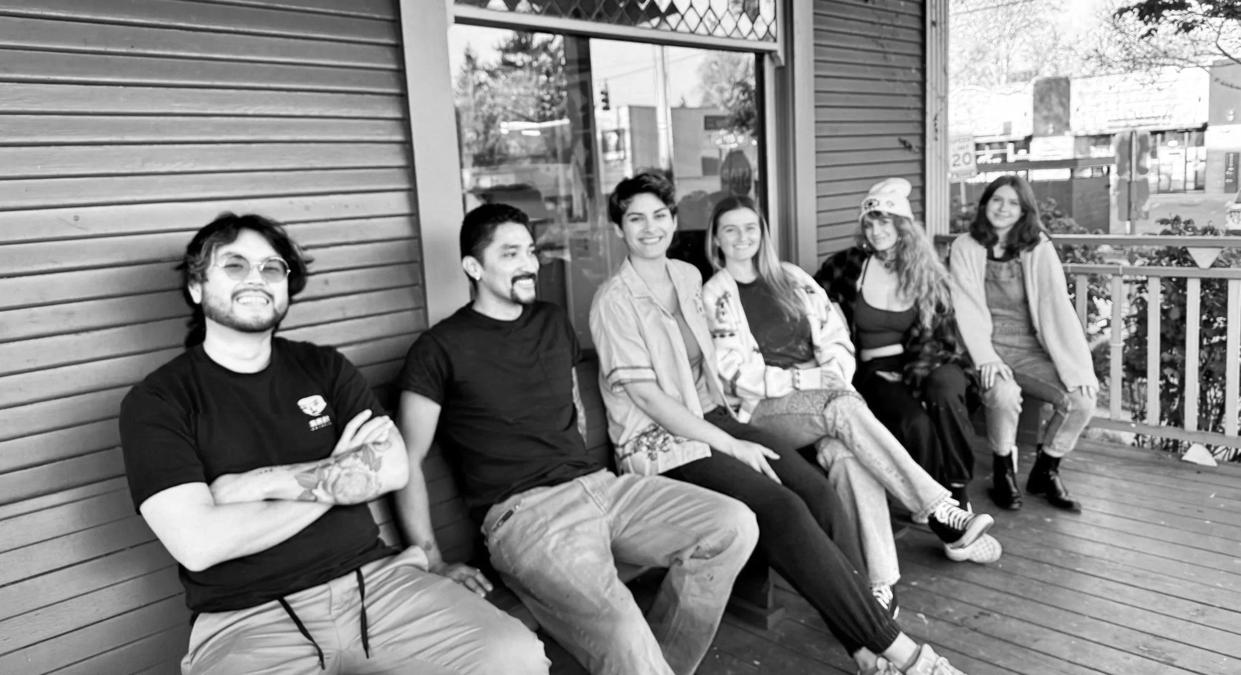 Tattoo artists at Tattoo 34 enjoying the sun on our shop porch on Hawthorne Blvd across from the New Seasons in Portland, Oregon. Portland tattoo artists, female tattoo artists, BIPOC tattoo artists