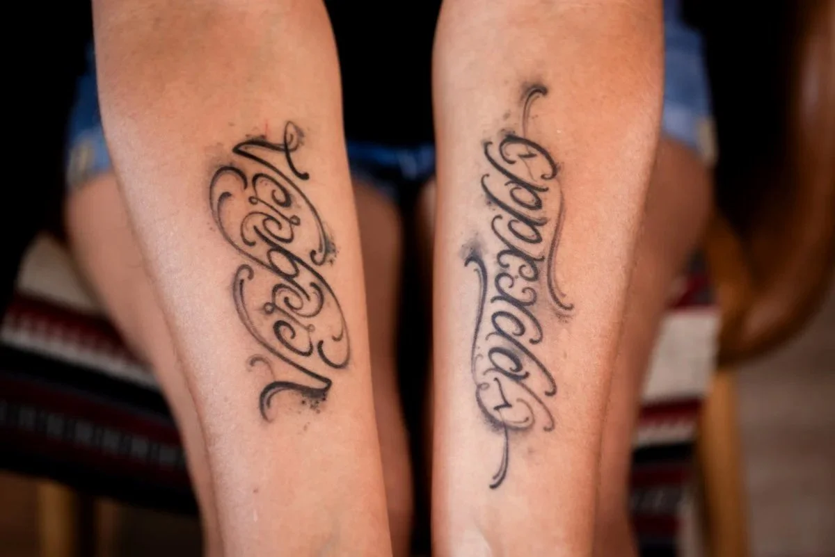 Text, lettering tattoo on melanated skin 