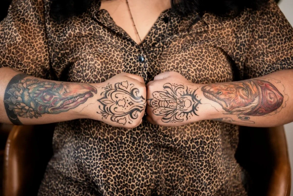 arm and hand tattoos on brown skin 