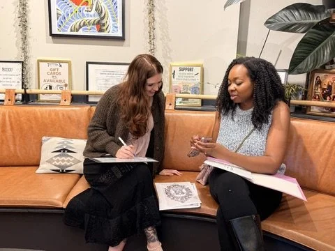 In shop consultation with tattoo artist Sierra women tattoo artist in Portland, OR at Tattoo 34 in SE on Hawthorne Blvd.