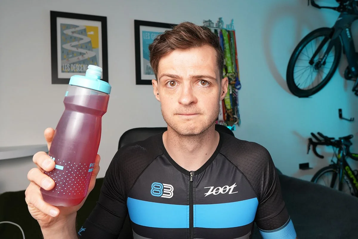 James is holding a sport bottle in his right hand