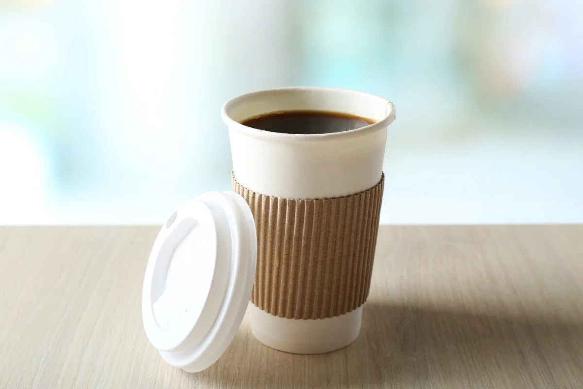 paper cup of coffee on a table