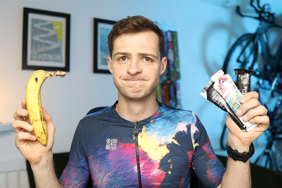 James holding triathlon nutrition products and banana
