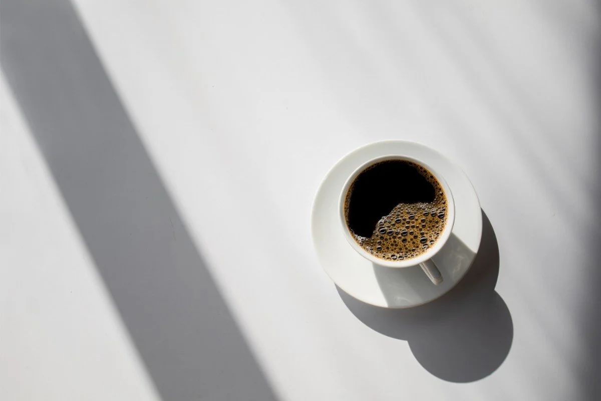 cup of coffee on white surface