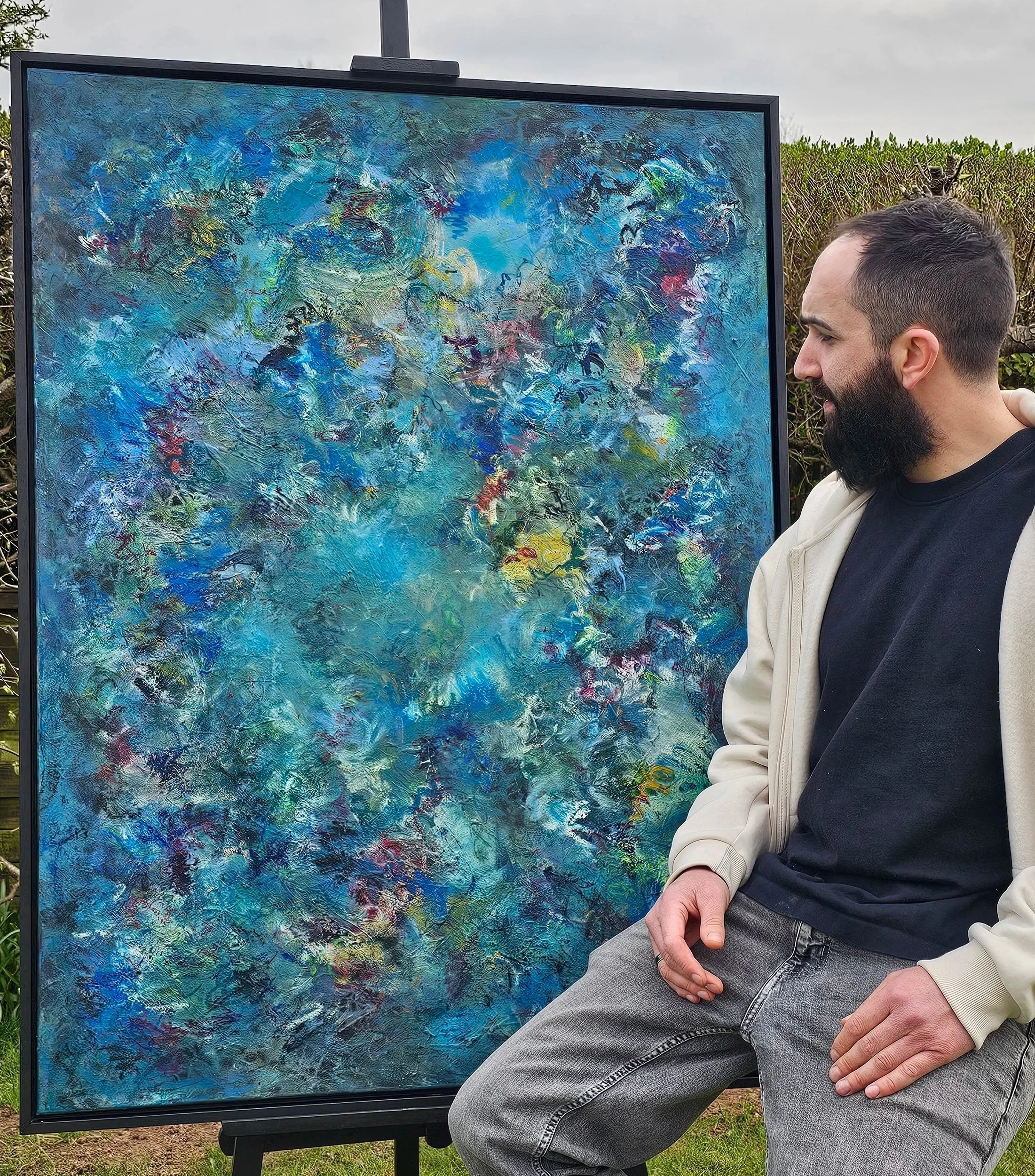 Artist Joe Eccles with abstract painting 'Letting Resolution Be'