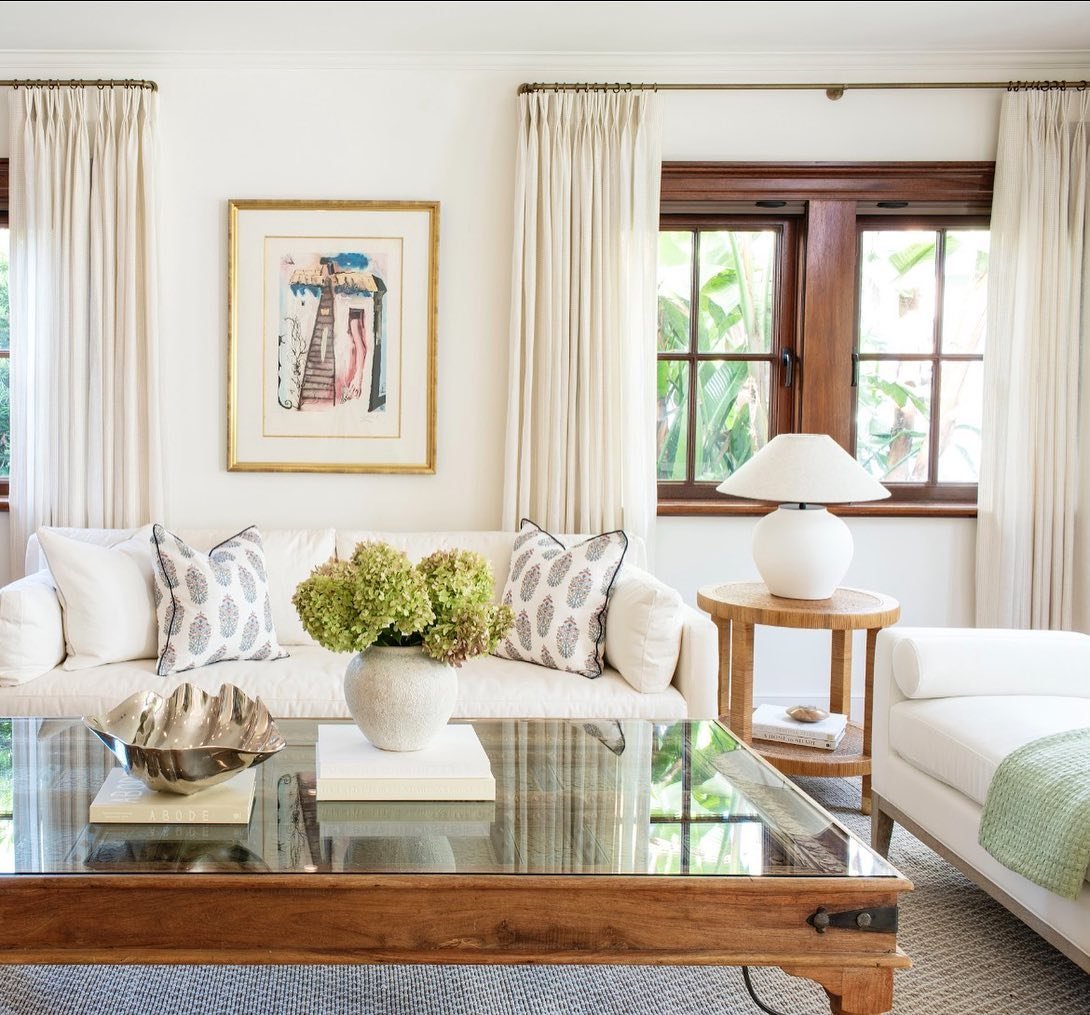 A warm and inviting Living Room in West Palm Beach. Original windows were saved and we combined the client&rsquo;s antique furniture with crisp whites. This home in the #sosowestpalmbeach neighborhood went from dark and heavy to bright and airy. 💫

