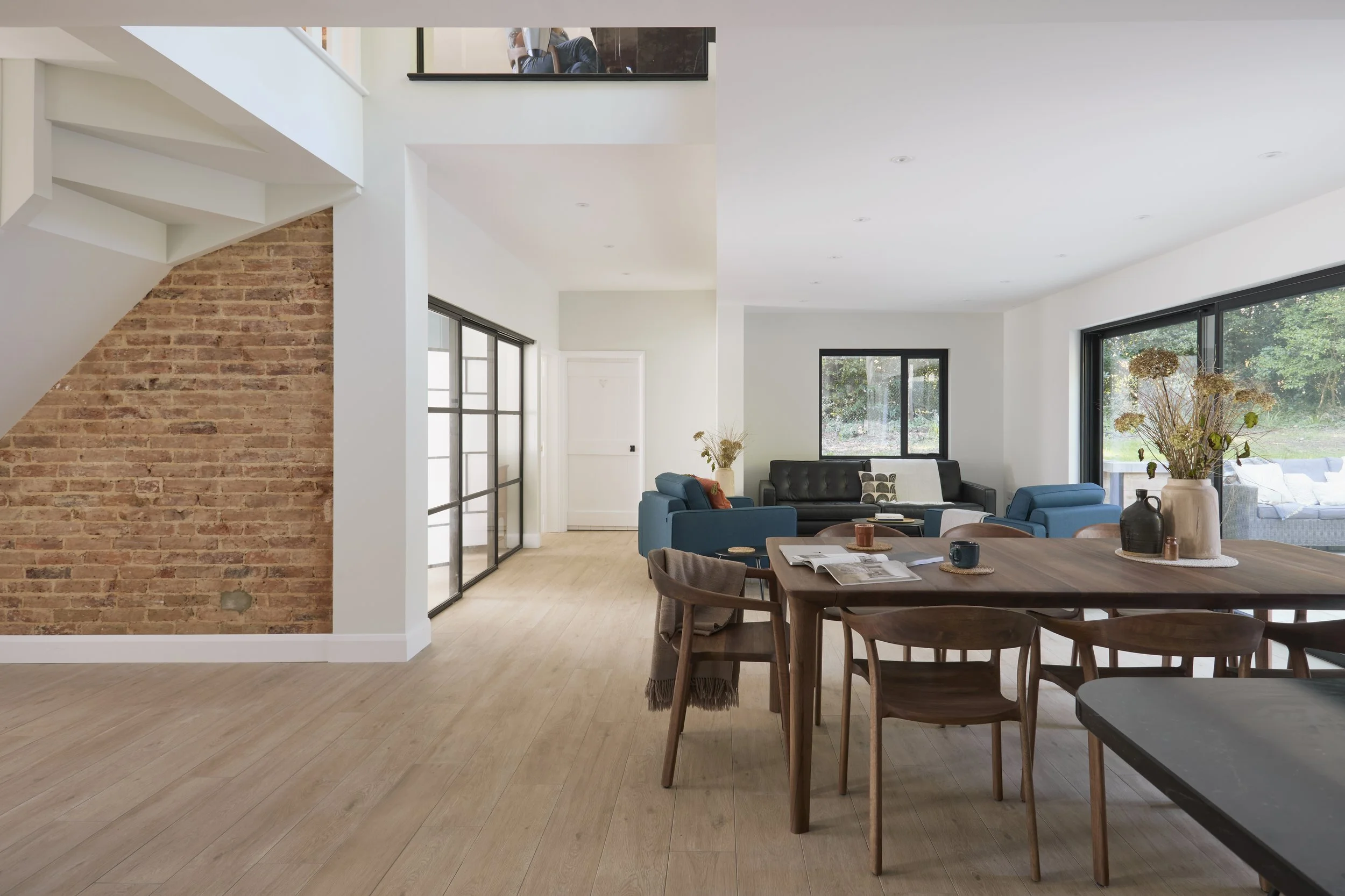 Indoor-outdoor living open planned living dining area in timeless contemporary home