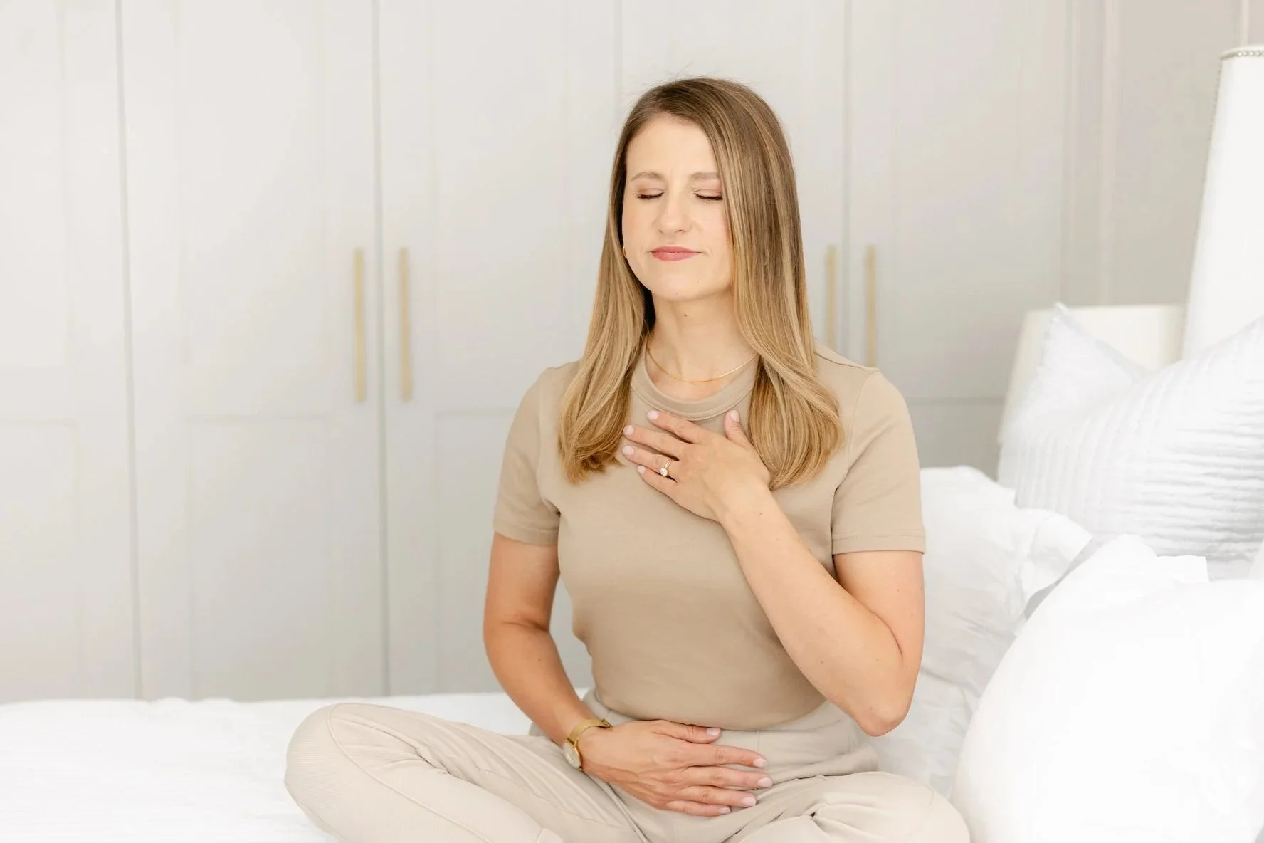 Rebecca Lloyd practising a grounding exercise, illustrating self-trust and inner foundation work for mothers