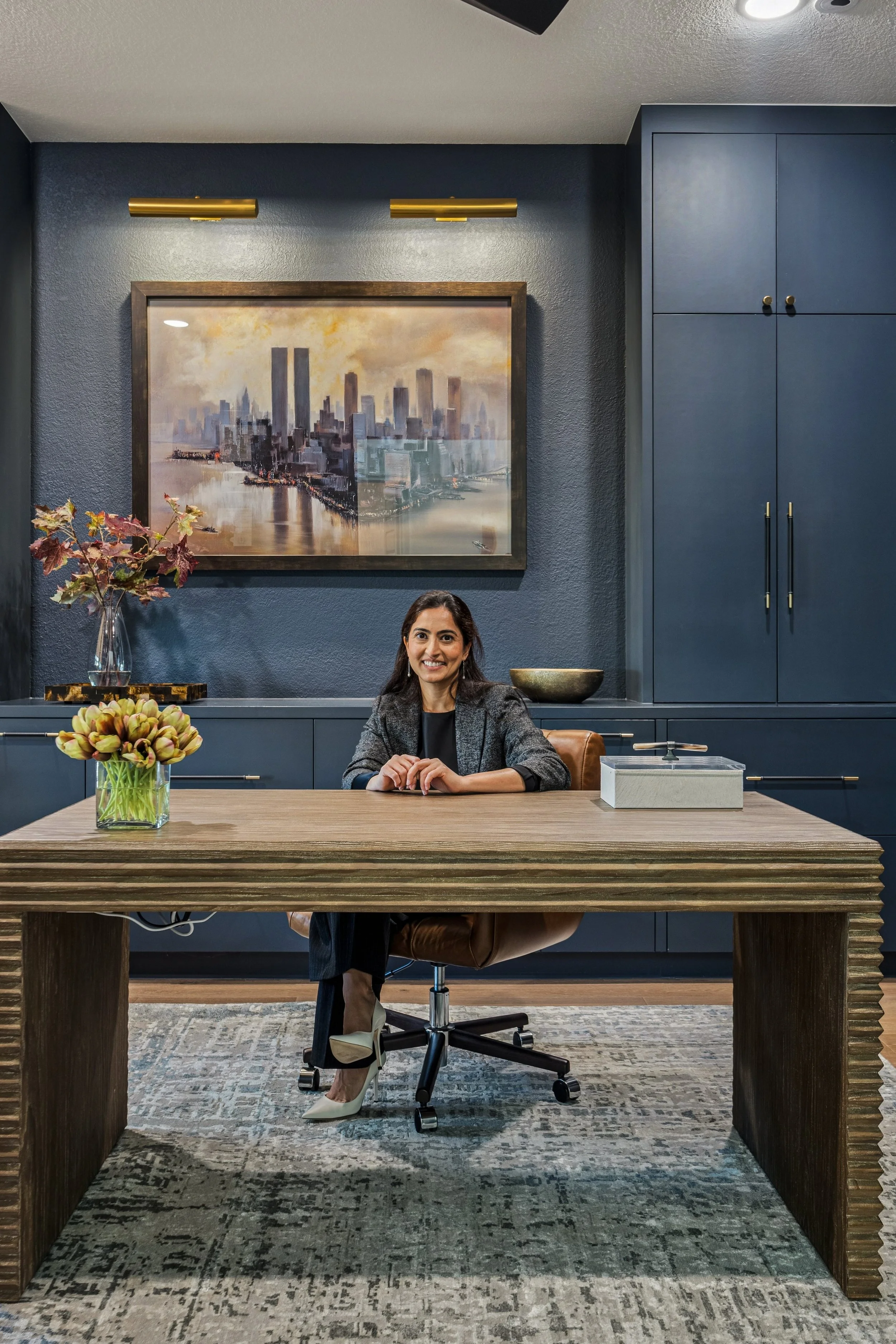 blue study with a beautiful desk and custom rug