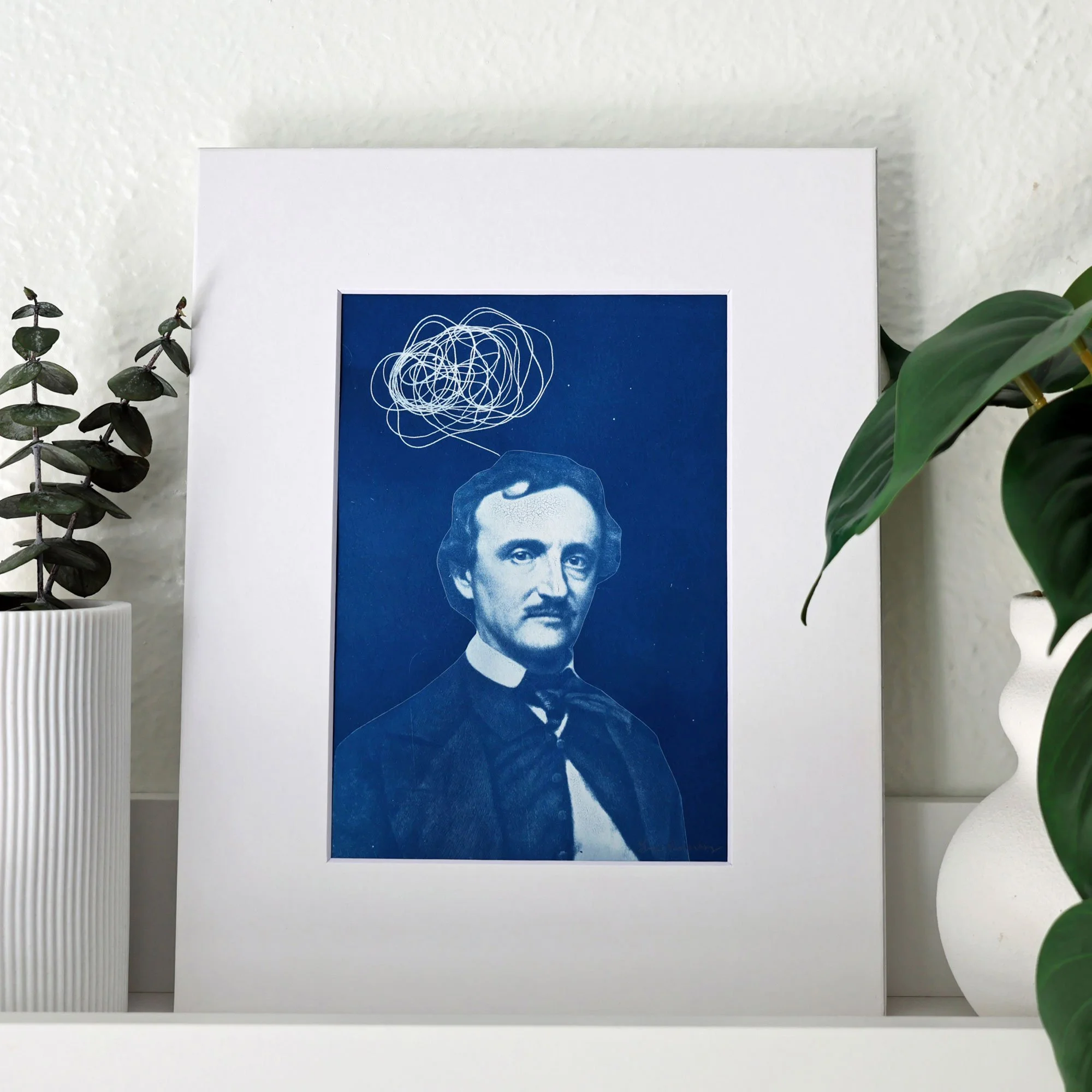 Cyanotype of Edgar Allan Poe with a scribble above his head indicating thoughts