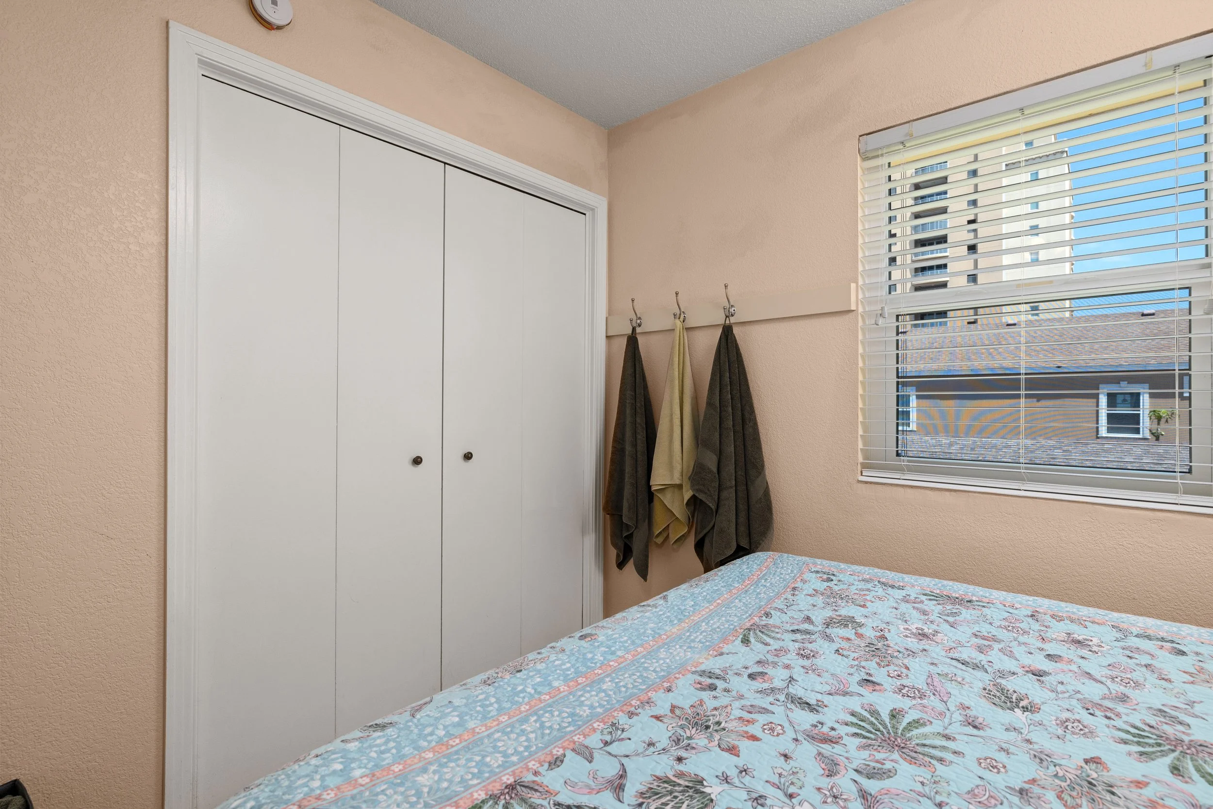 1st bedroom closet and hooks for towels 