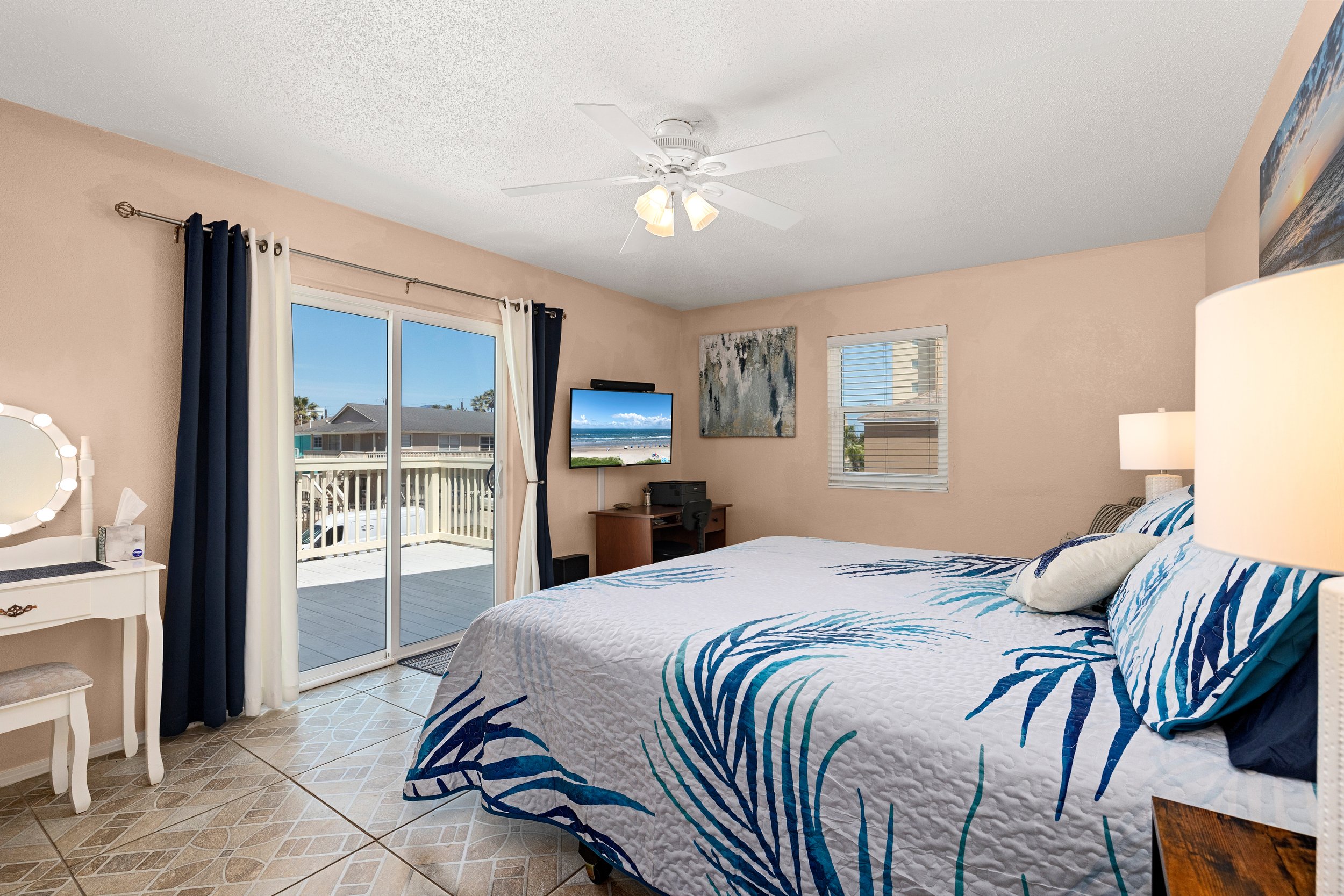 Master bedroom that leads to front deck