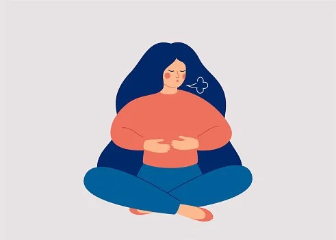Illustration of a woman sitting cross-legged with a stomach ache, holding her stomach with a cloud indicating discomfort.