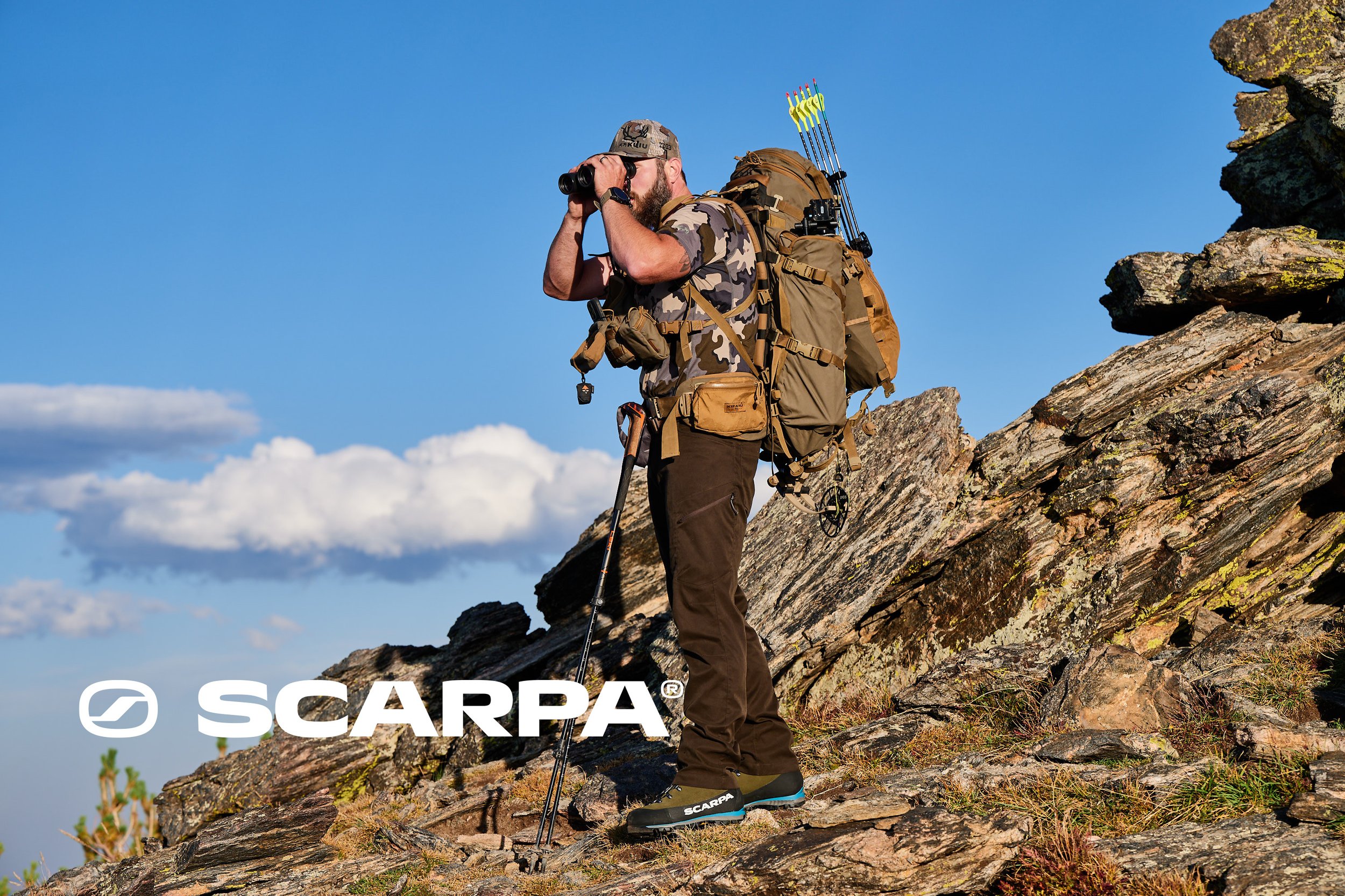 Hunter in SCARPA Grand Dru and Wrangell GTX boots on a high-country ridge