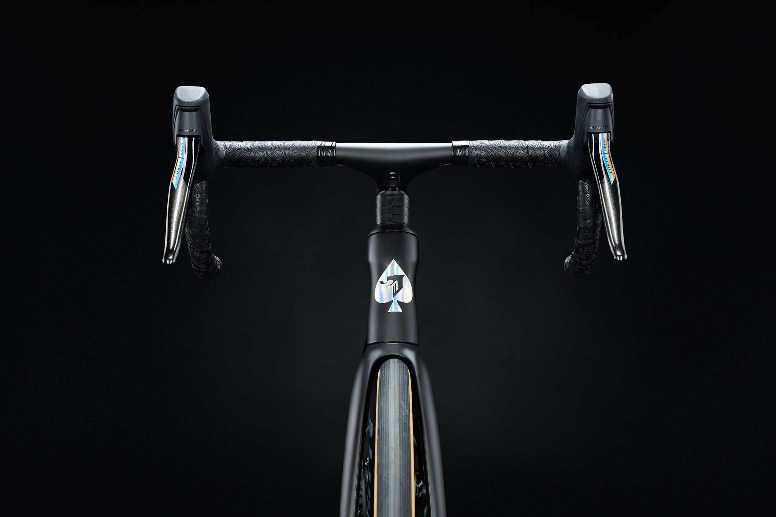 Ritte Esprit carbon road bike on a dark studio backdrop with detail lighting