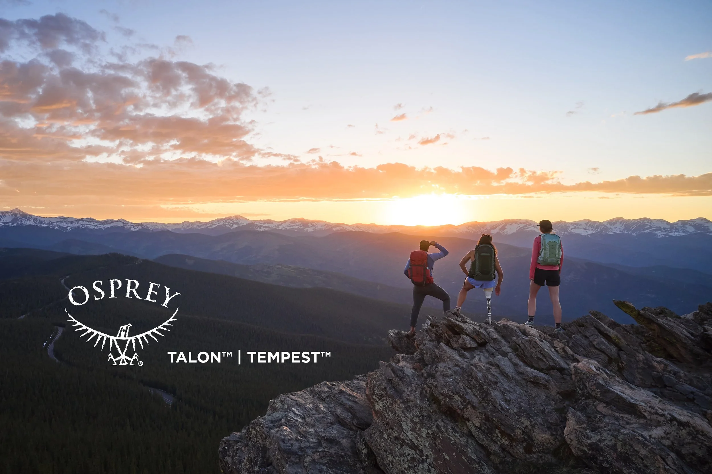 Hikers in Osprey Tempest and Talon packs on a rocky summit above the Front Range