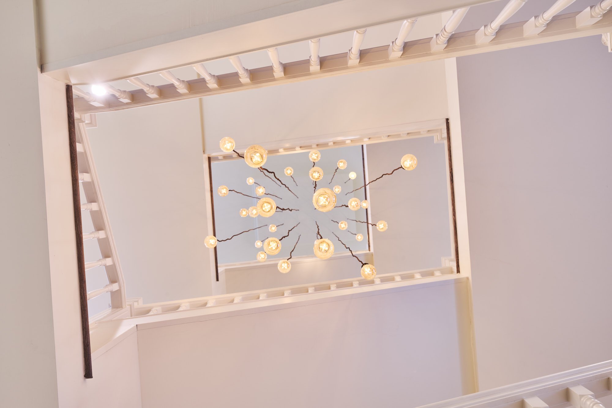 Gansmann Residence stairwell and chandelier by ZAGA Design in Denver, Colorado
