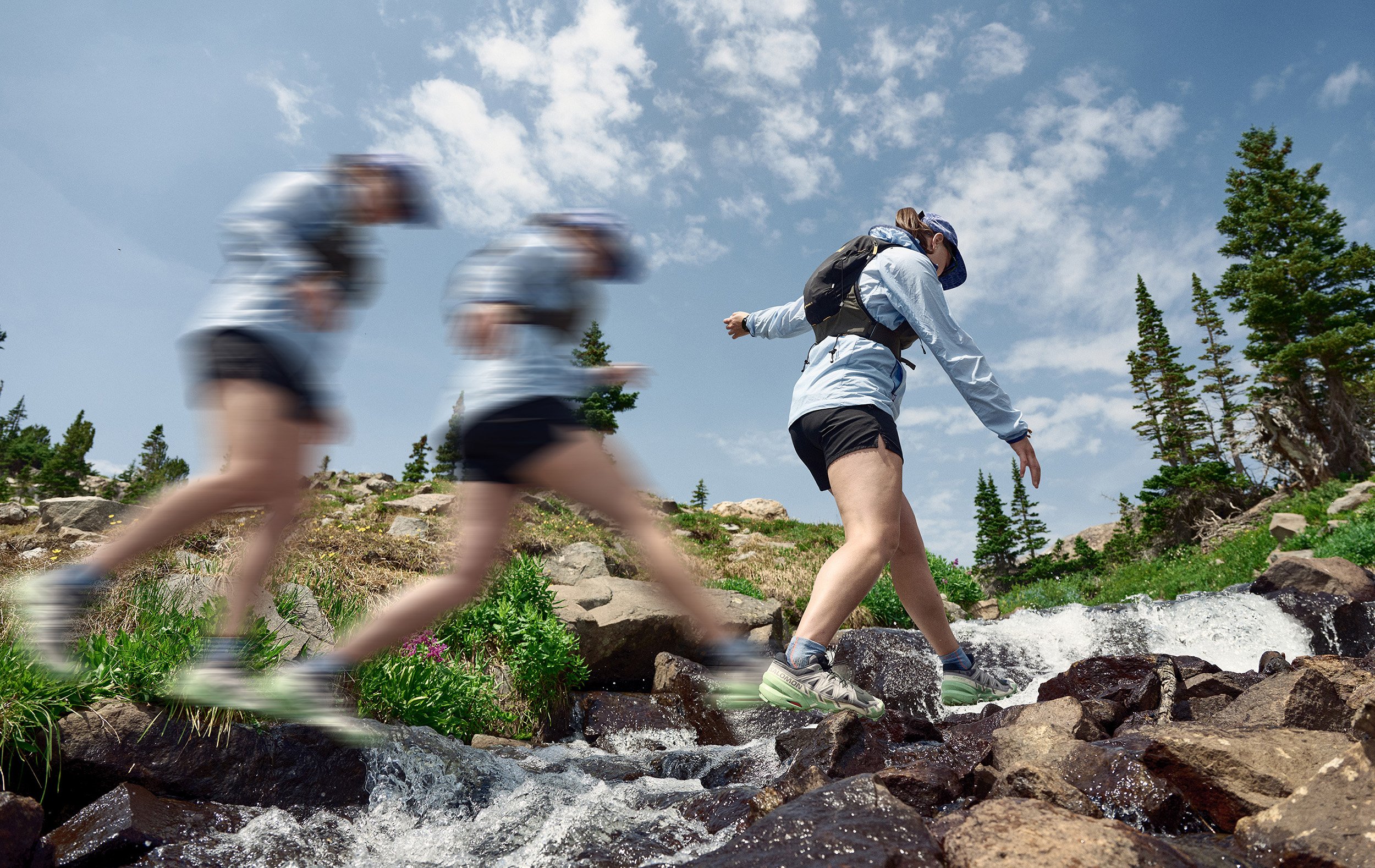 Multiple exposure of a trail runner in Salomon SPEEDCROSS 6 shoes hopping an alpine creek, campaign photography for Salomon
