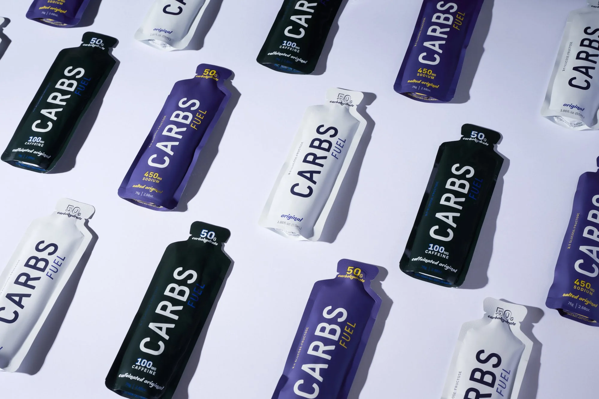Carbs Fuel energy gel and powder packets arranged for studio product photography