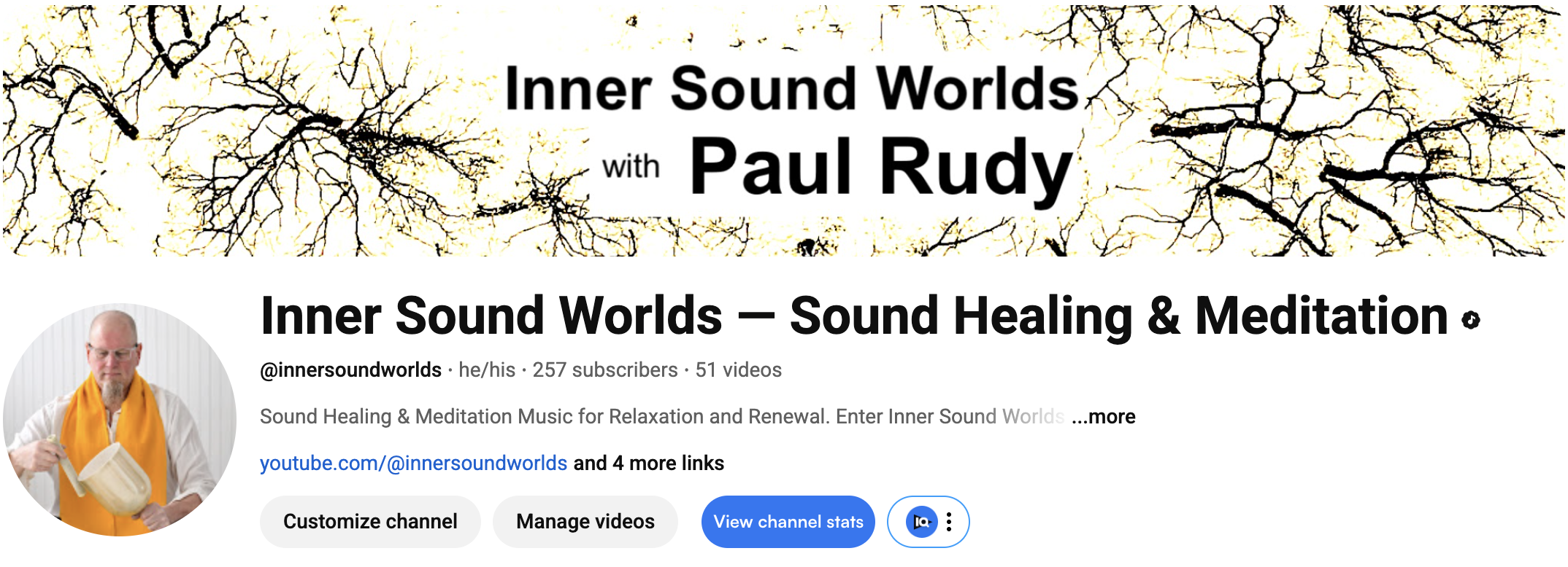 YouTube channel banner for 'Inner Sound Worlds' featuring black and yellow tree branches and text about sound healing and meditation with Paul Rudy, including a profile picture of Paul Rudy holding a mug and wearing an orange scarf.