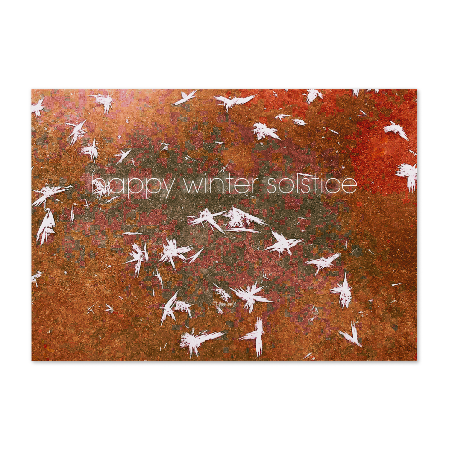 Rust-colored surface with white feather-shaped cutouts and overlaid text reading 'happy winter solstice'.