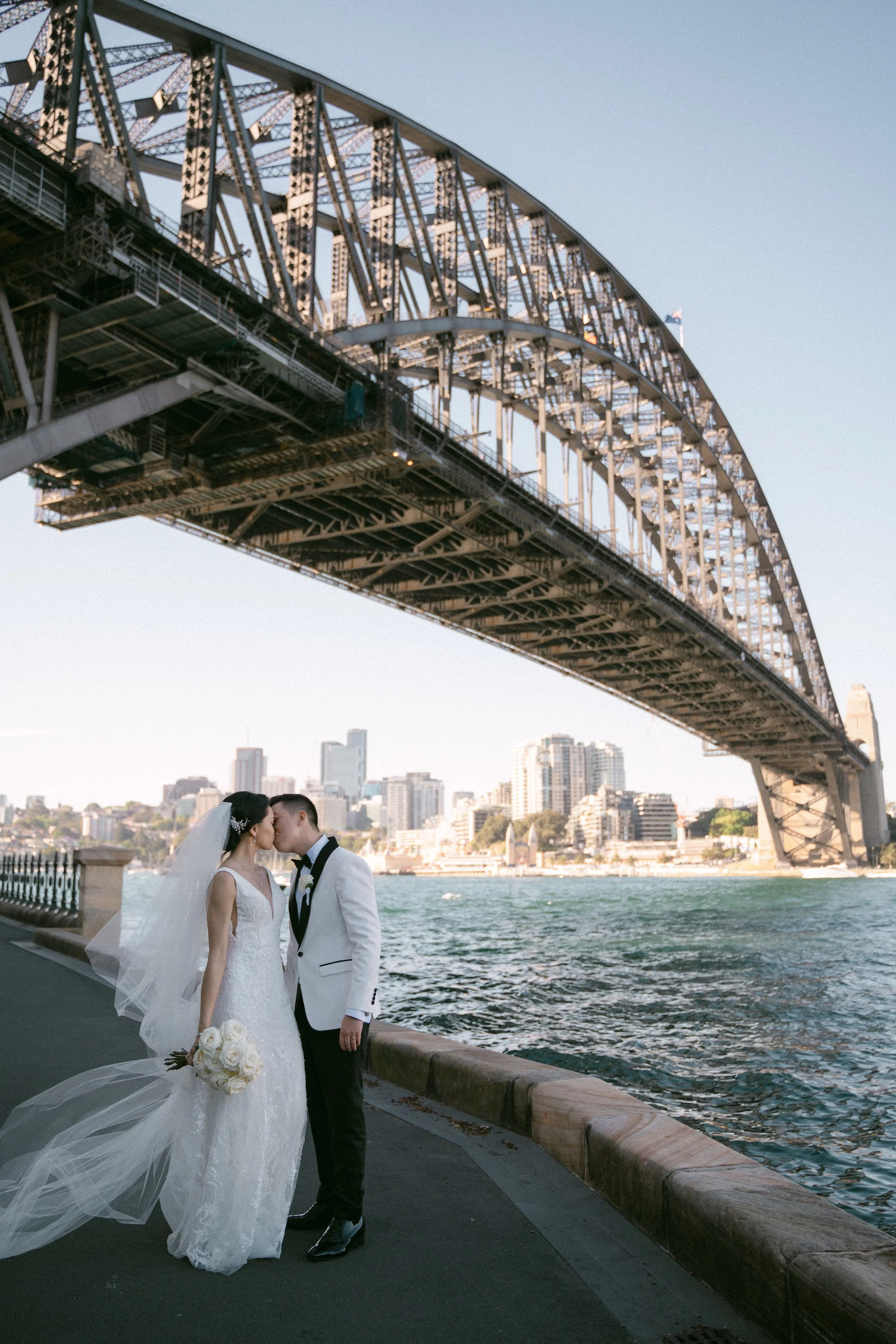 Romantic wedding portrait of newlyweds by sydney harbour.