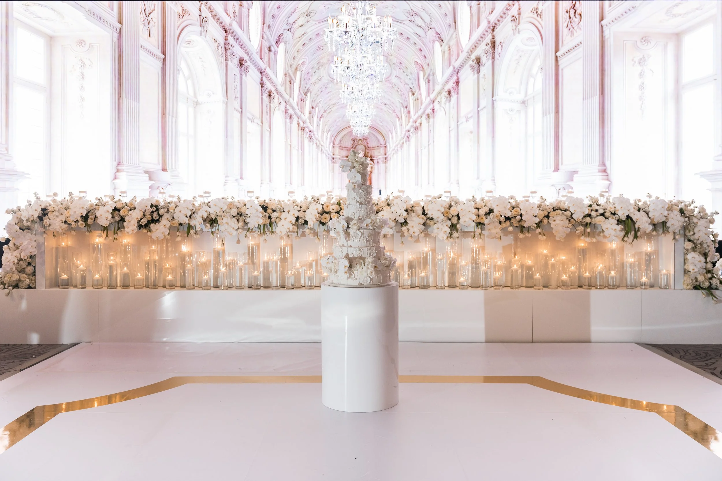 Luxury wedding reception with white and gold dancefloor