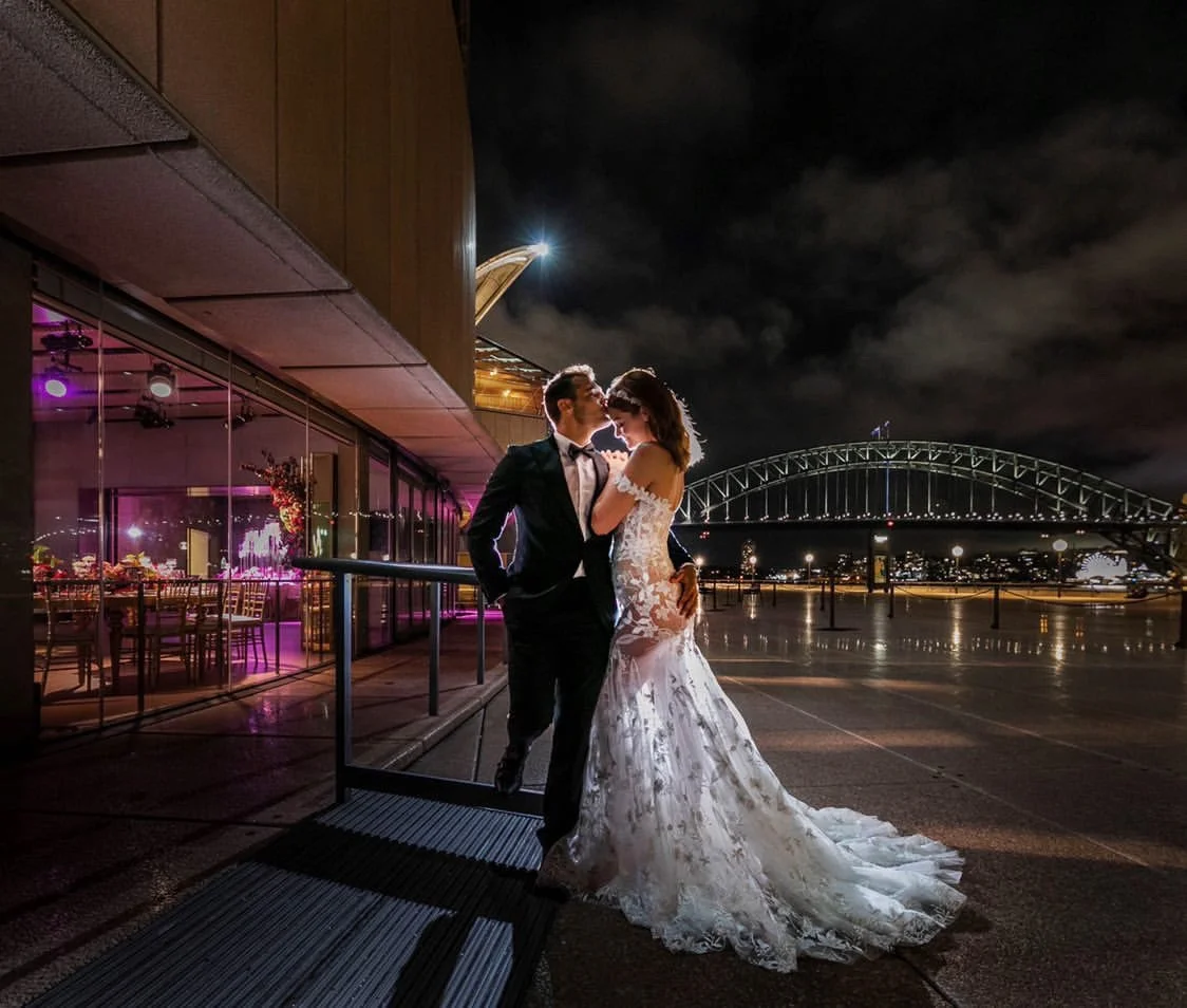 Candid bride and groom portrait with Sydney Harbour Bridge as the backdrop.