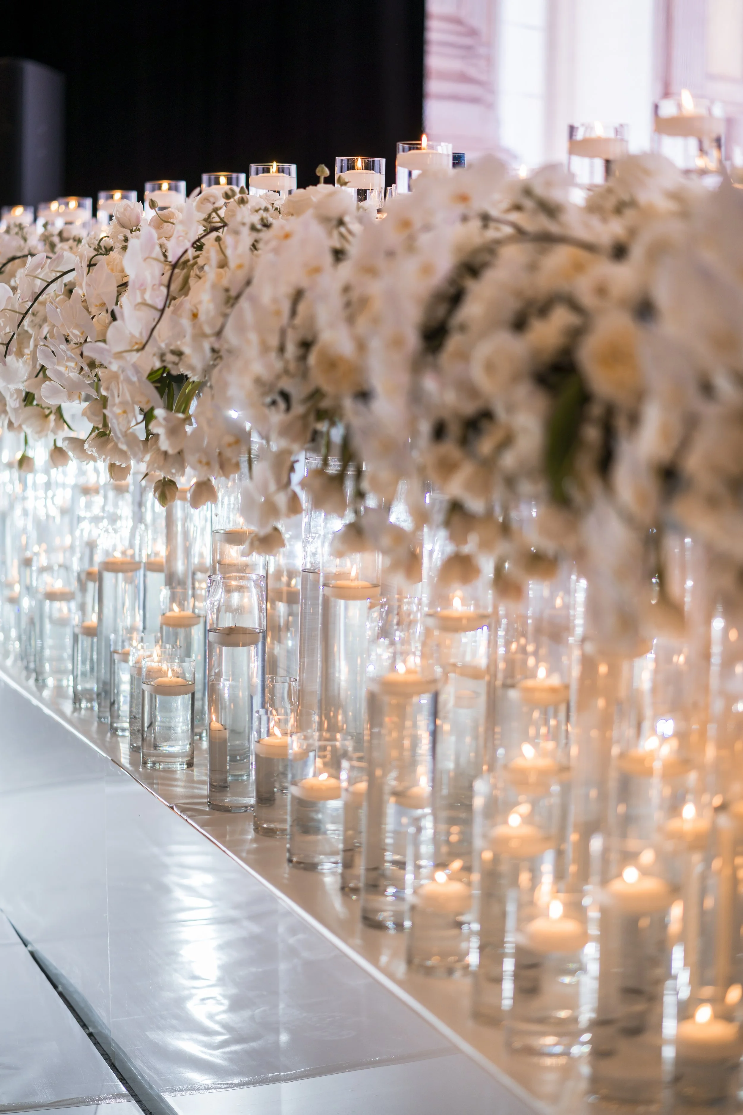 Bridal table styled with luxury floating candles and flowers
