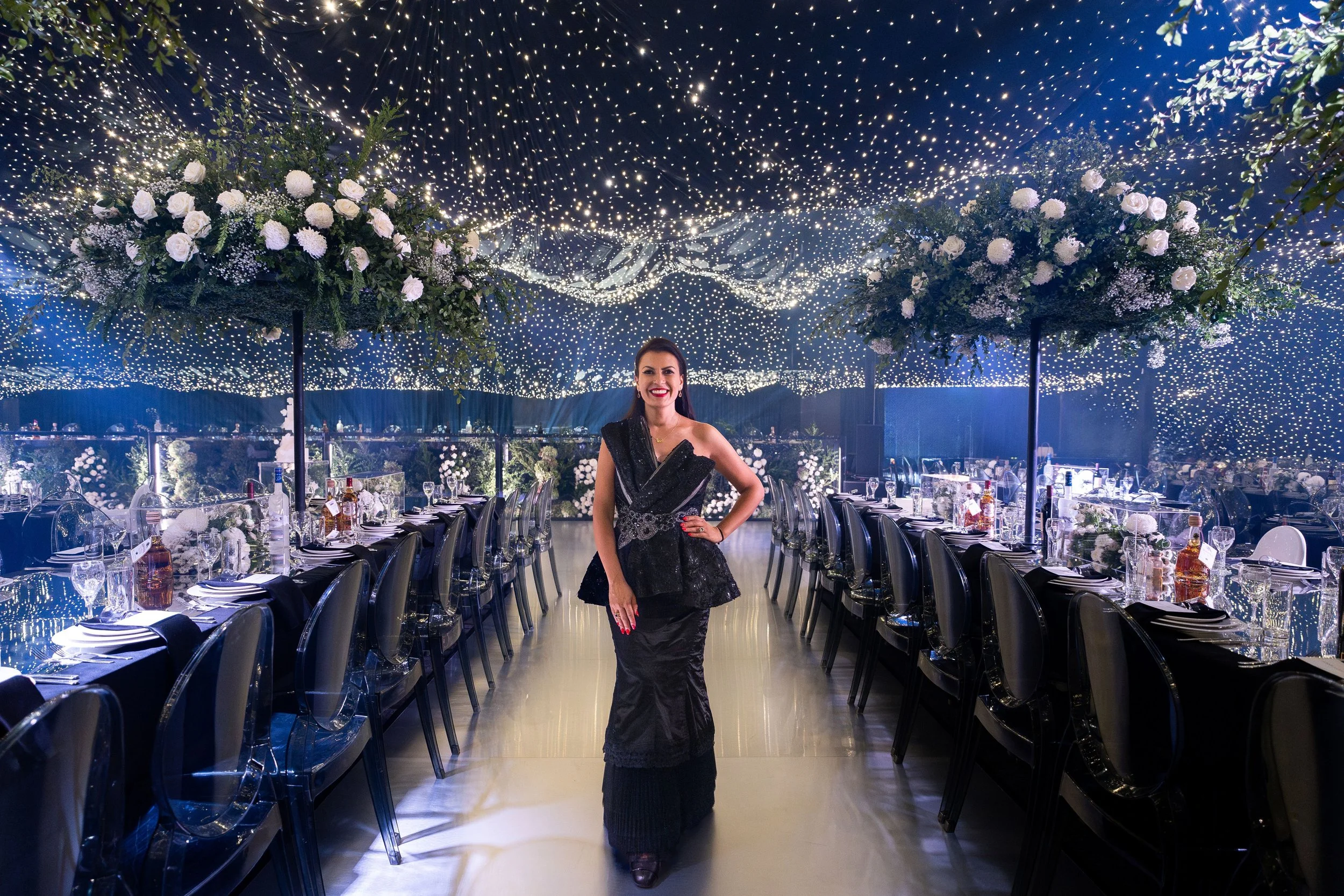 Beautiful reception table styling with romantic flowers and glass candelabras