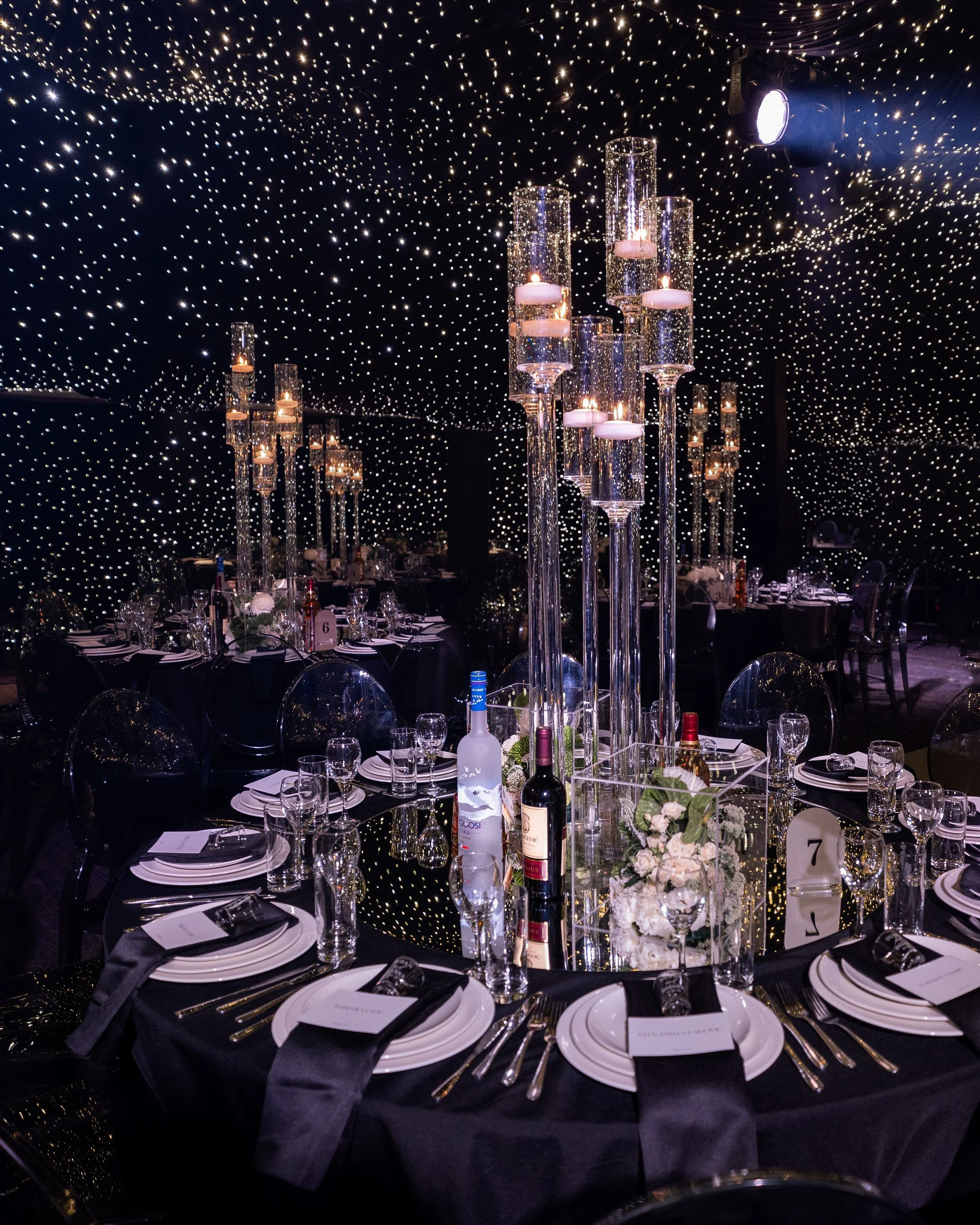 Elegant table settings on round guest tables