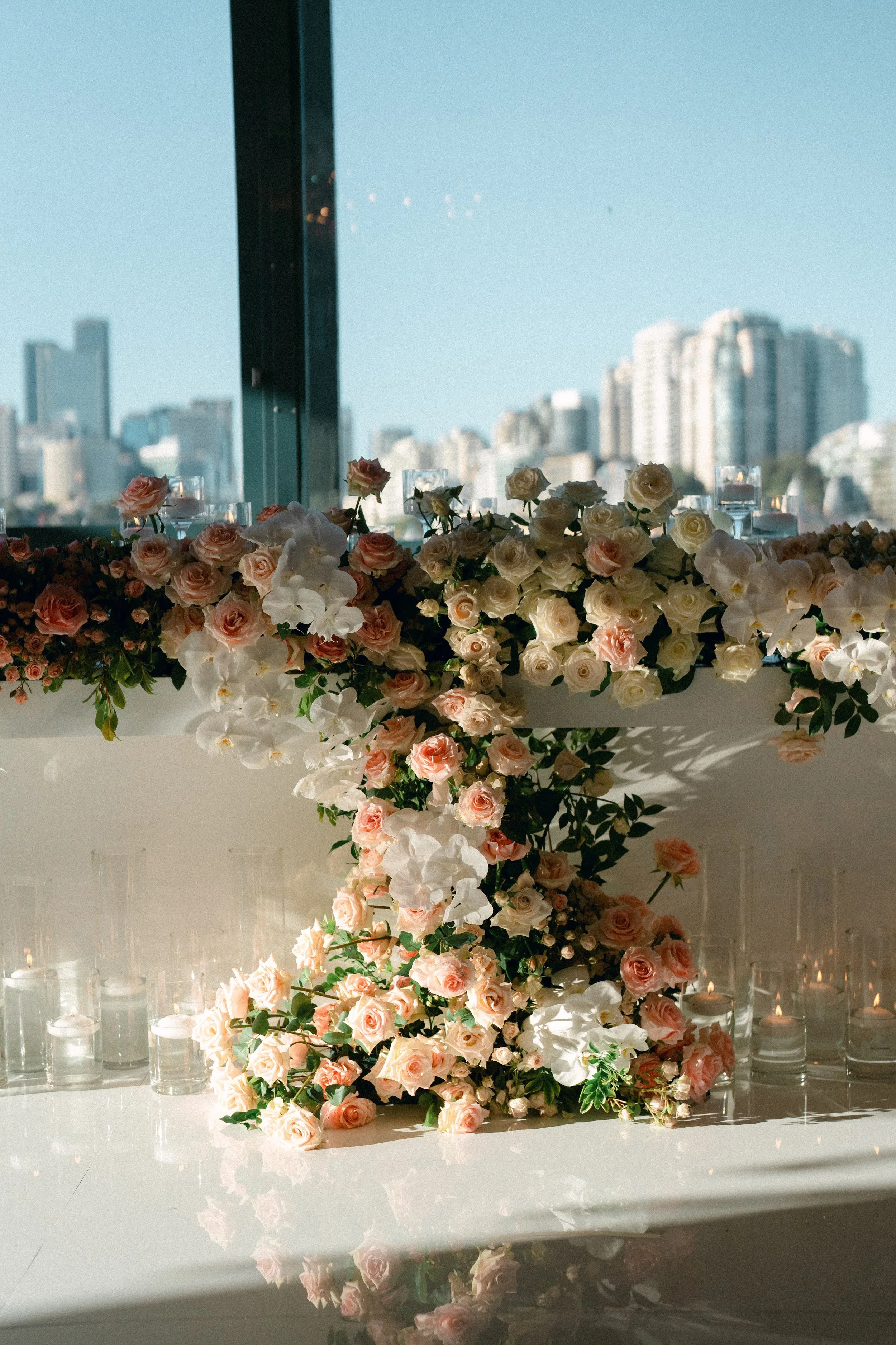 Luxury bridal table decorated with flowers and Sydney harbour as the backdrop.