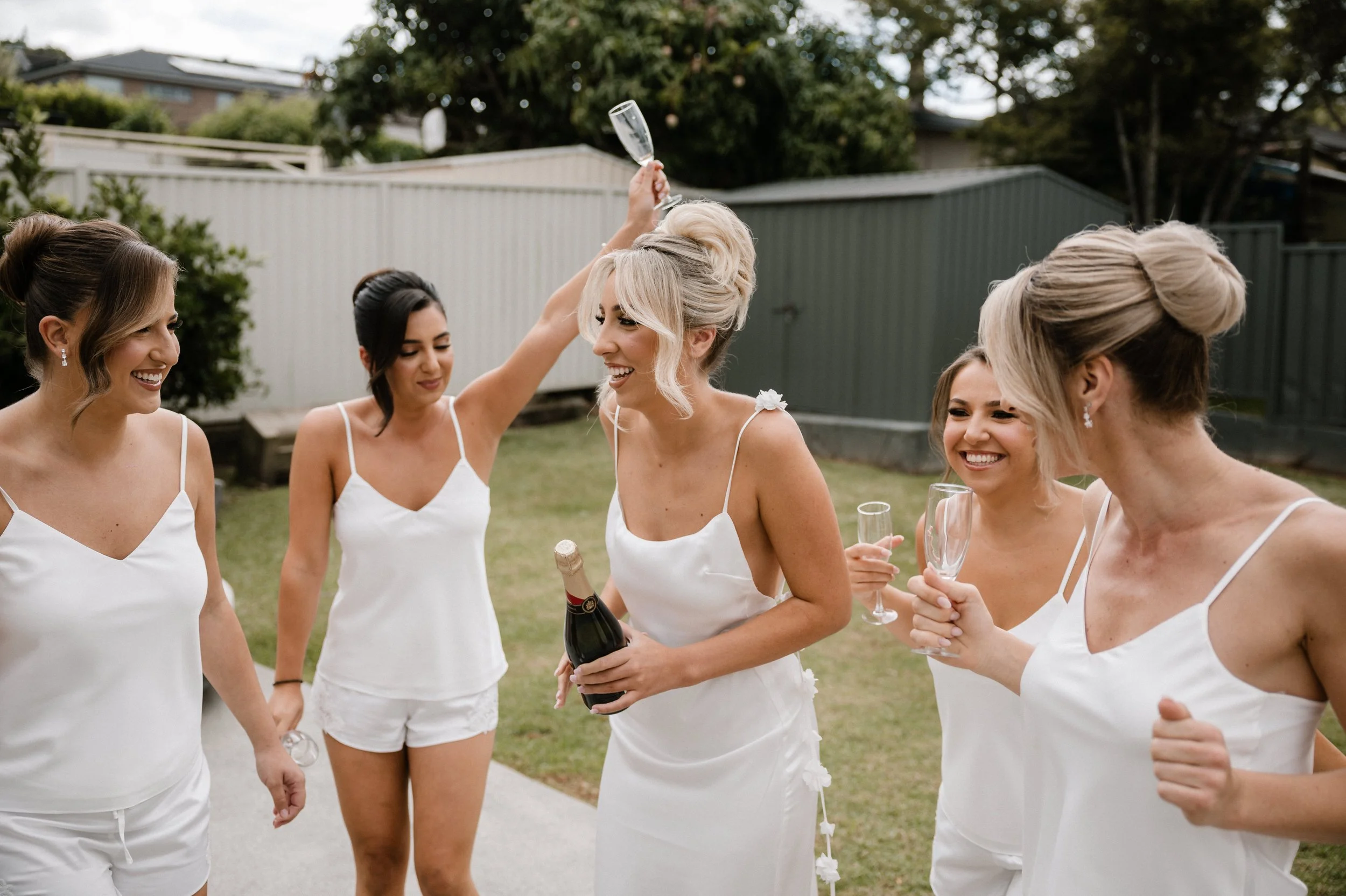 bride-with-bridesmaids-getting-ready.jpg